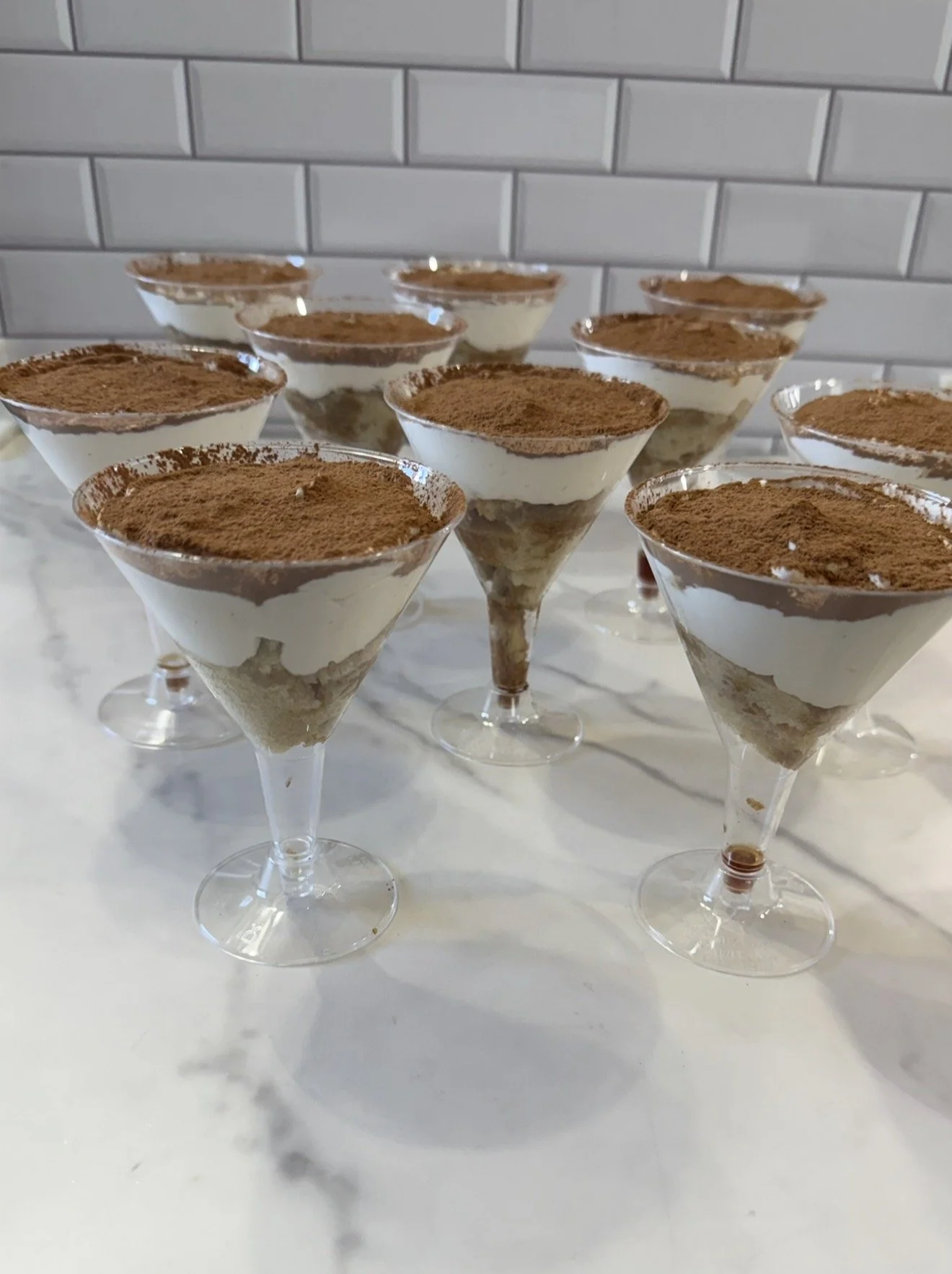 Vegan tiramisu in individual portions served in martini glasses
