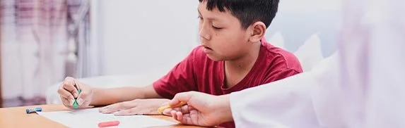 Child participating in pediatric therapy in Phoenix, Arizona using play-based activities that support motivation and engagement.
