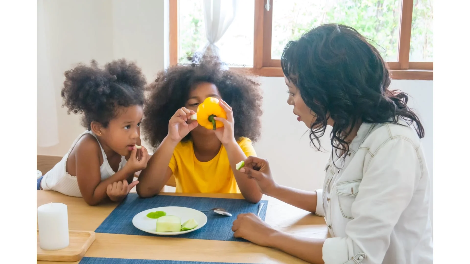 Pediatric occupational therapist working with children on feeding skills during a sensory-based therapy session in Arizona