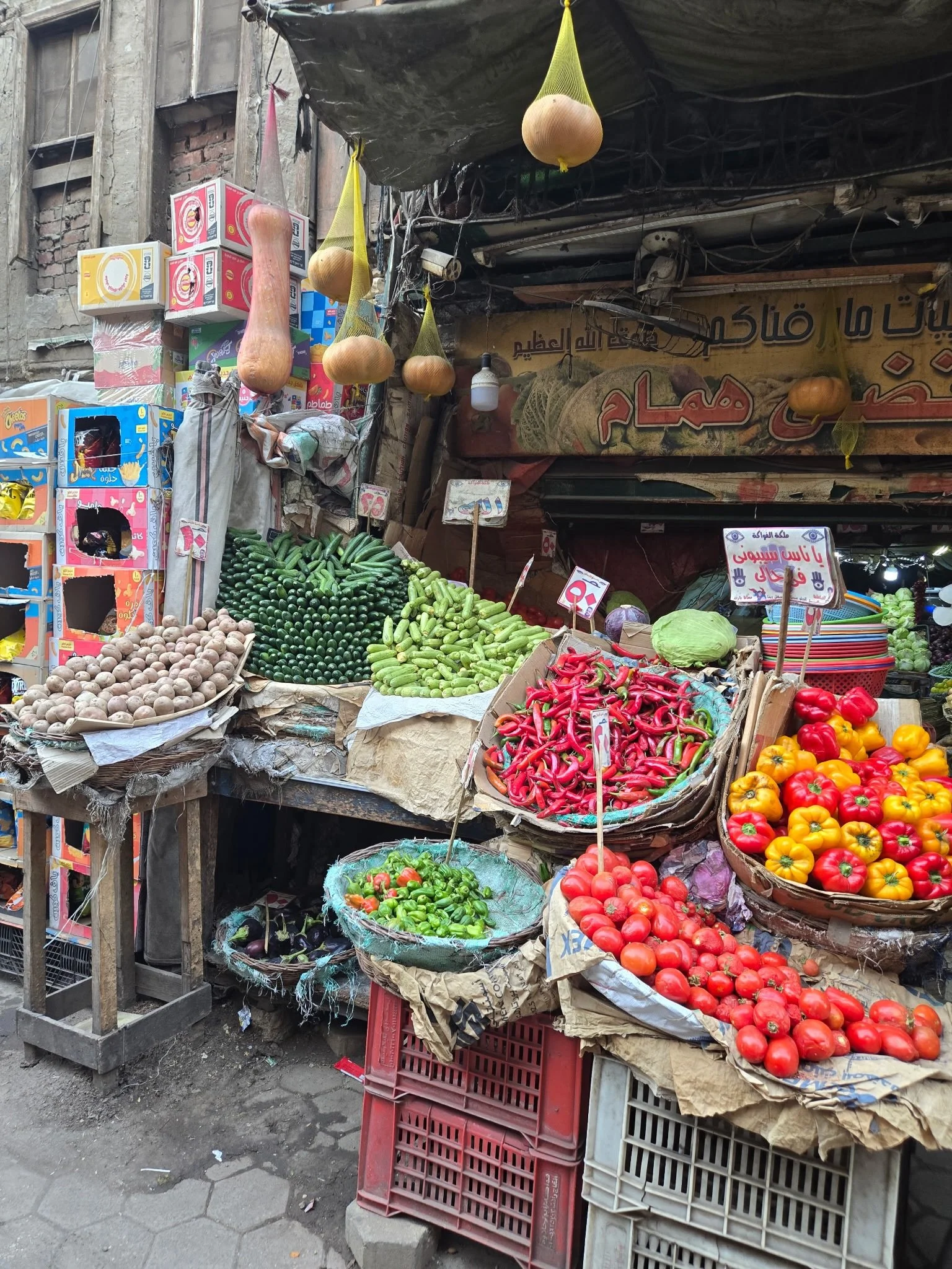 On our way to visit the El-Khayamiya Cloth Market in Islamic Cairo we walked through this brilliantly hued + scented market that is a food microcosm of the cacophony + chaos of the city. As scooters, bikes + cars careen through the narrow lanes, beep