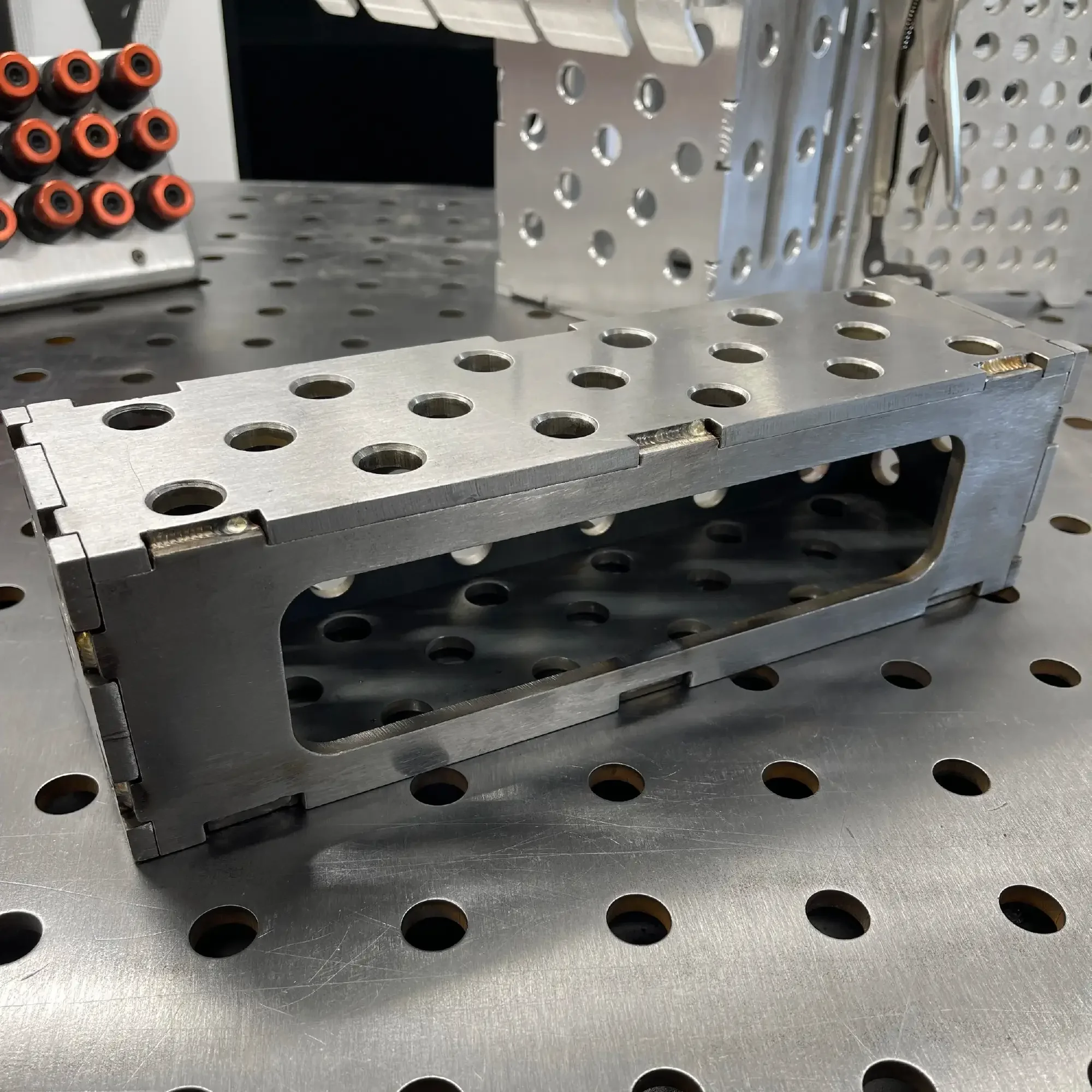 Steel Slim Riser Block – side access port visible, precision hole pattern detail