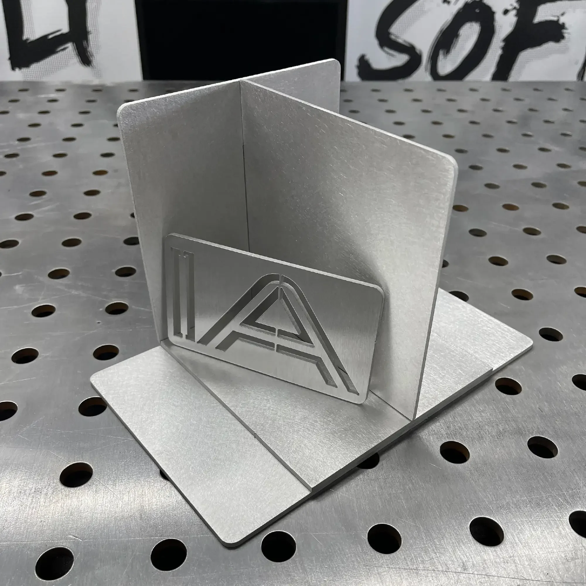 Aluminium TIG Practice KIT-1 “The Professor” — IA-FAB logo panel on assembled training fixture with fillet and lap joint setup