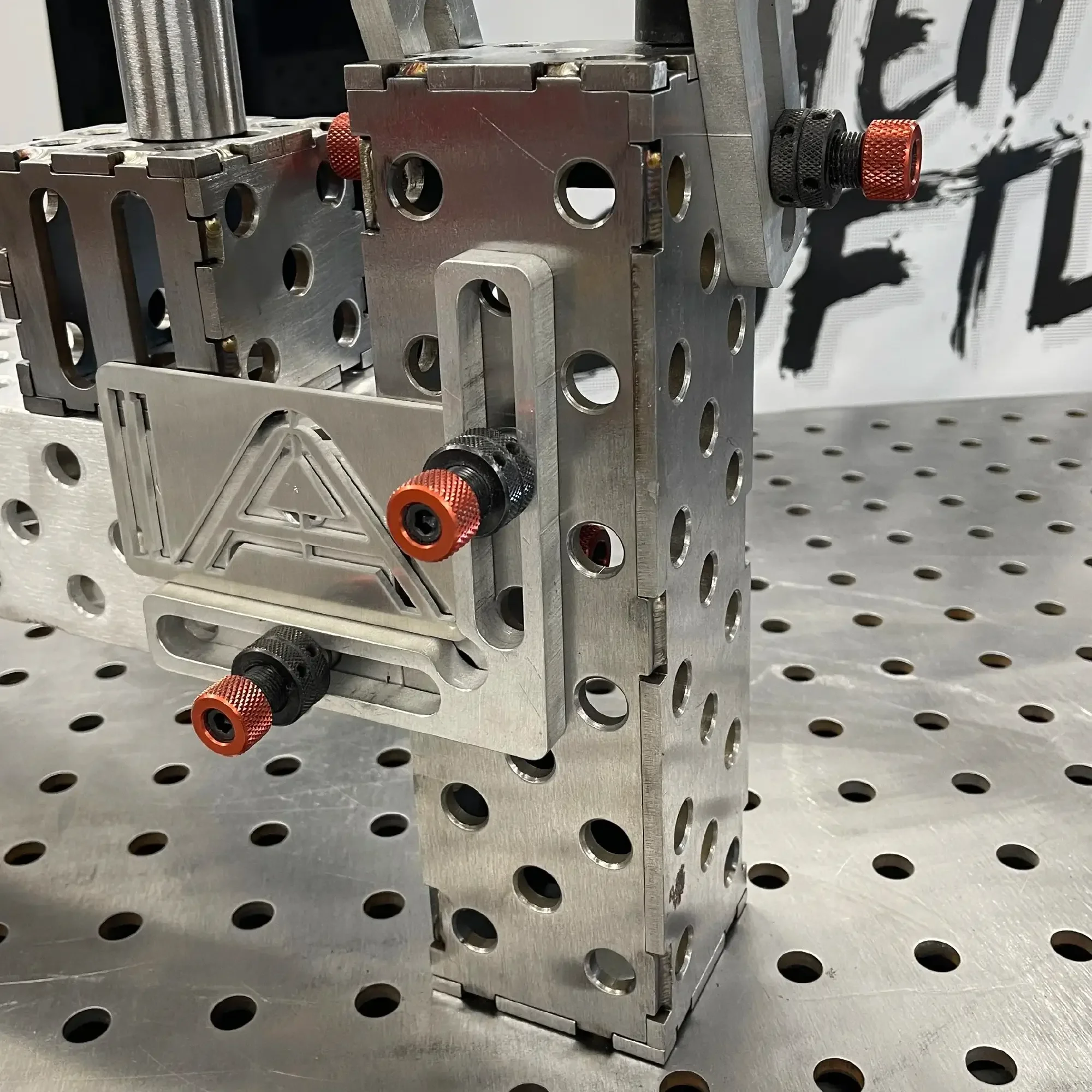 Steel Slim Riser Block – mounted in TIG welding setup with IA-FAB clamp accessories