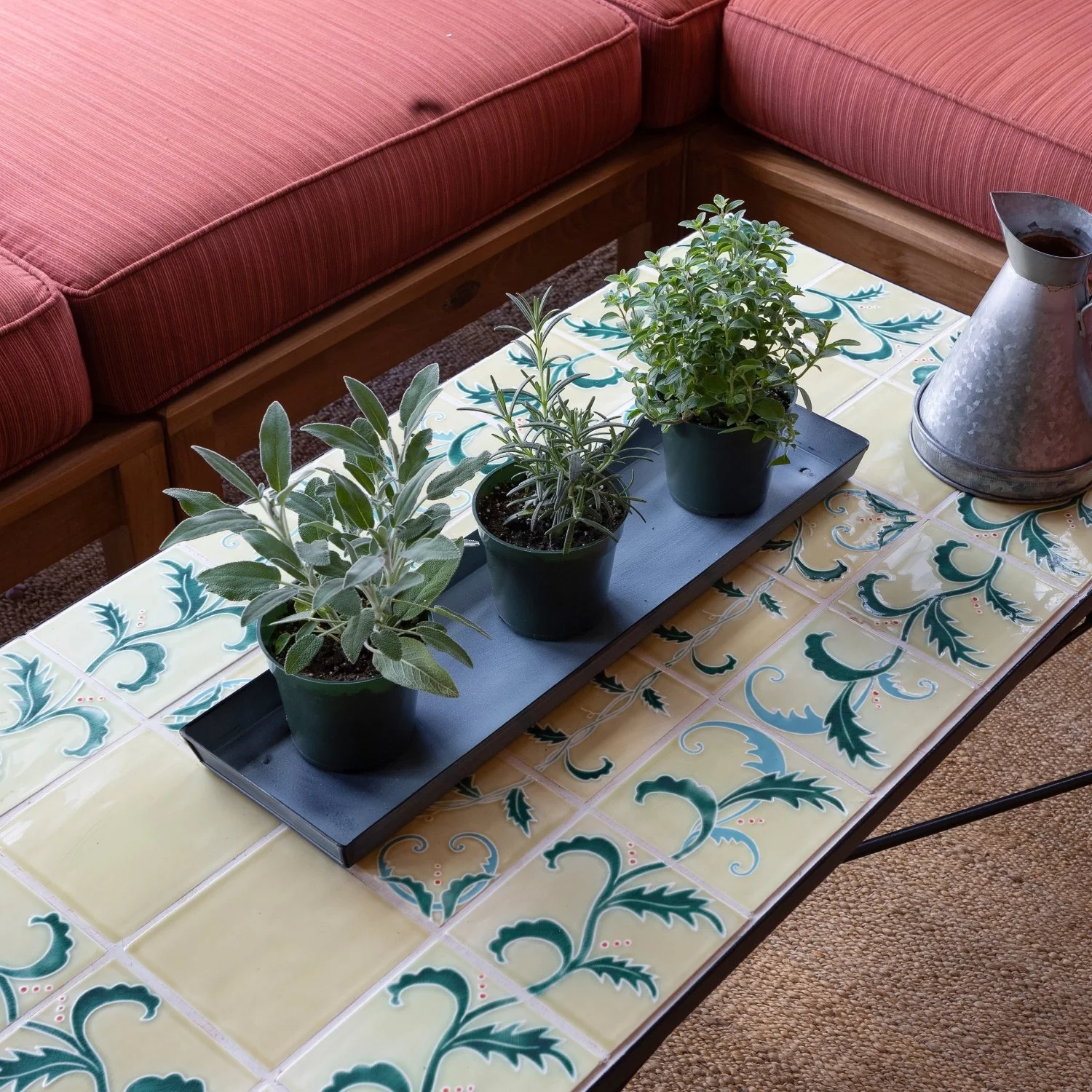Galvanized steel tray for plants. Tray is coated with a blue patina finish. Tray is shown holding three herb plants approximately 3 to 4 inches around.