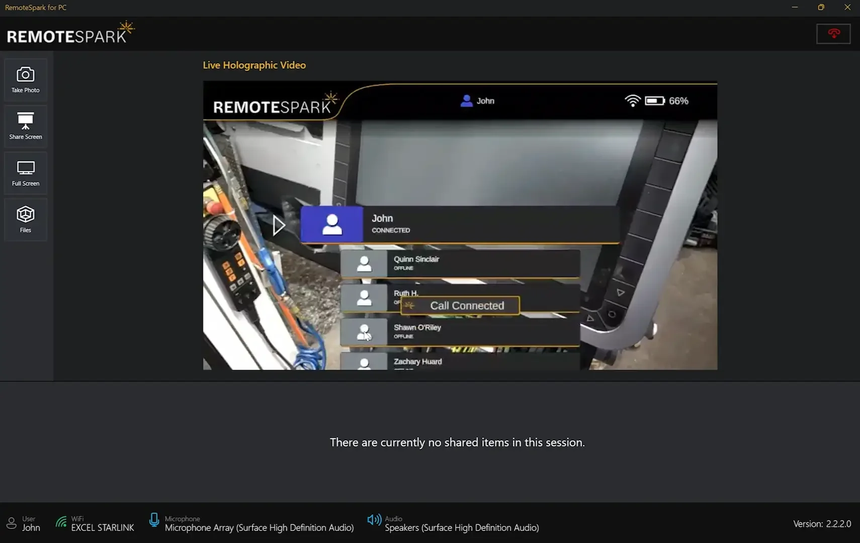 Screenshot of RemoteSpark software showing a live holographic video of a device with a list of contacts