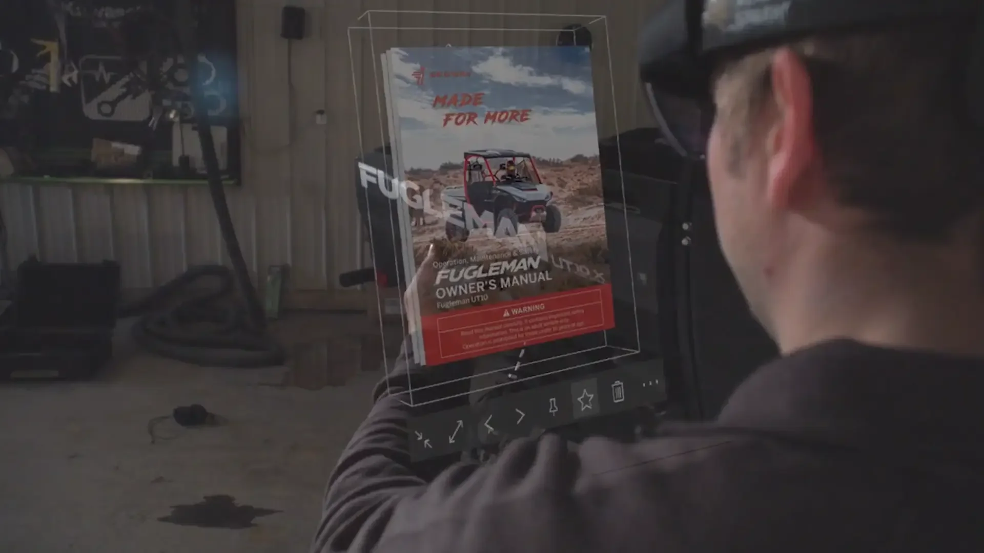 Person wearing Mixed Reality glasses looking at the owner's manual for a utility vehicle, with an outdoor garage or workshop setting in the background.