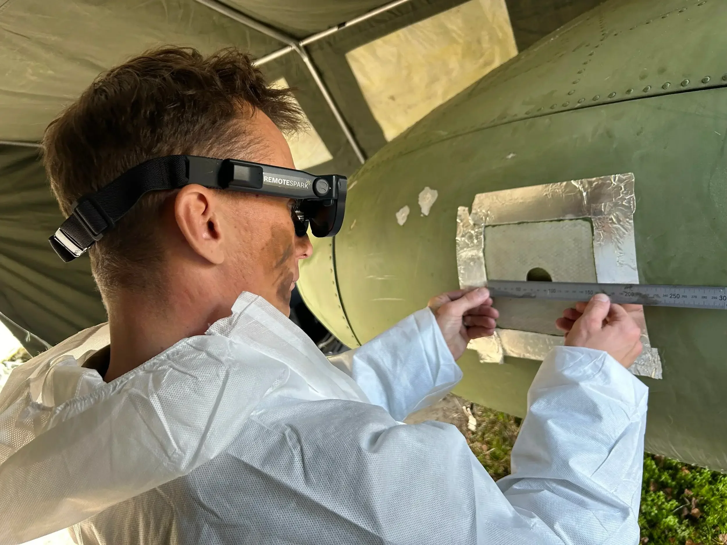 A frontline worker equipped with an augmented reality headset using RemoteSpark for visual inspection