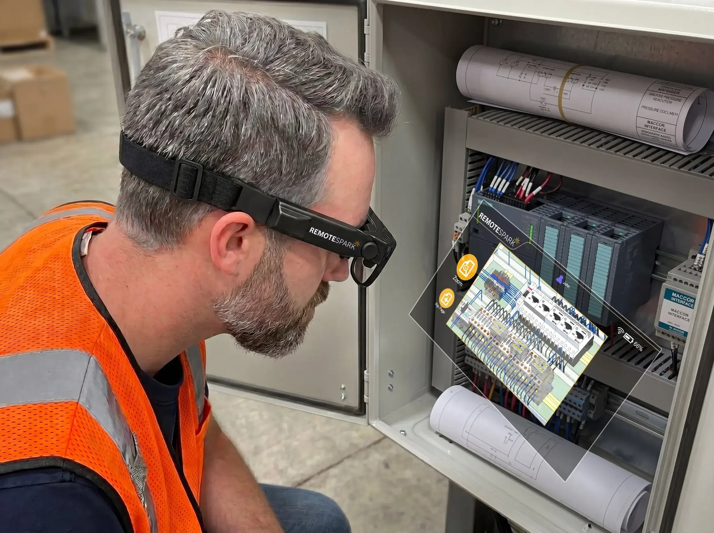 A man looking at an electrical panel with a pair of augmented reality smart glasses running RemoteSpark