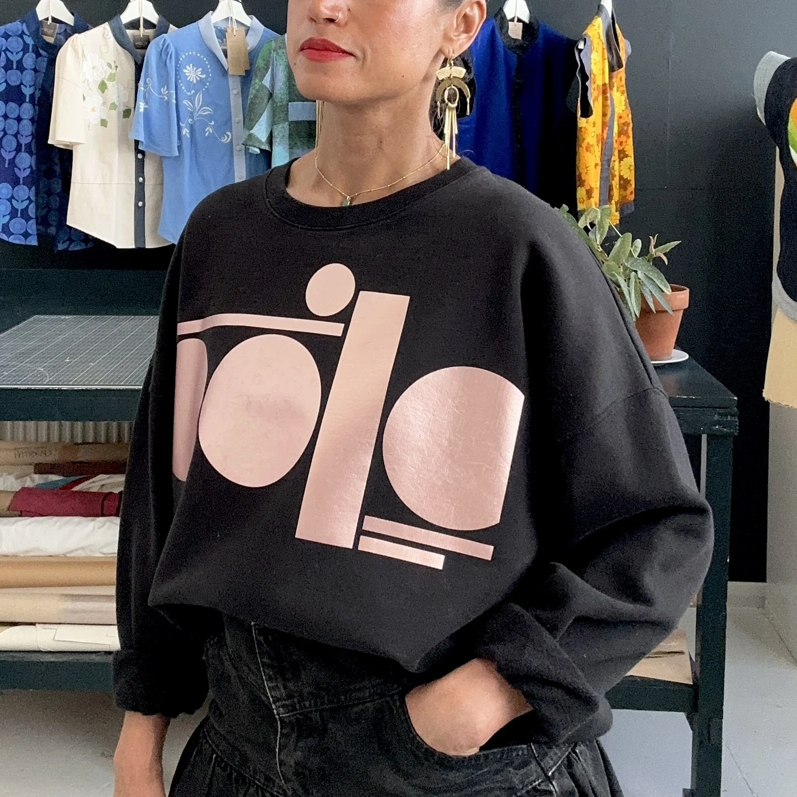 Rose gold tag on cream sweatshirt women’s fit