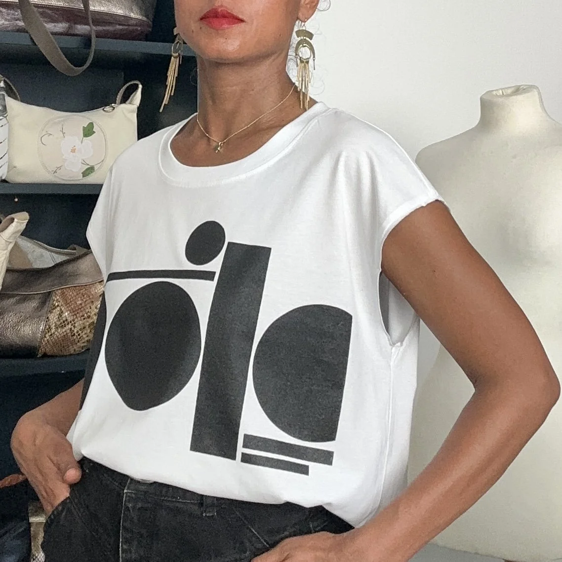 black tag on white raw tank - women's fit