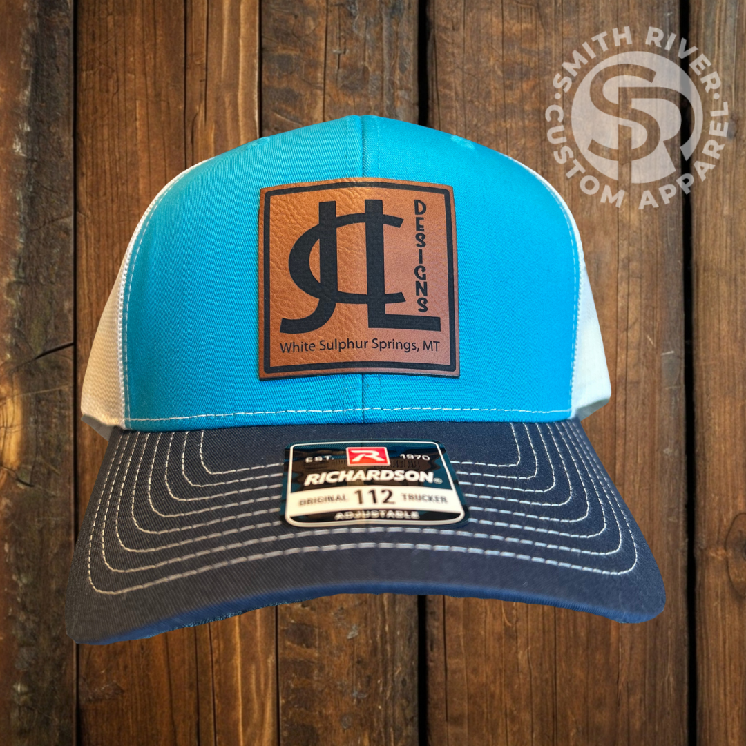 leather patch hat made by smith river custom apparel. featuring a rawhide patch.