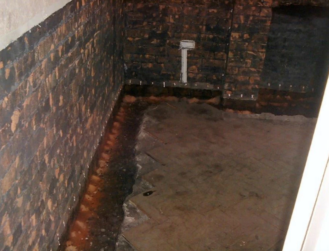 Damp Proof Course injection on brick wall in Bristol