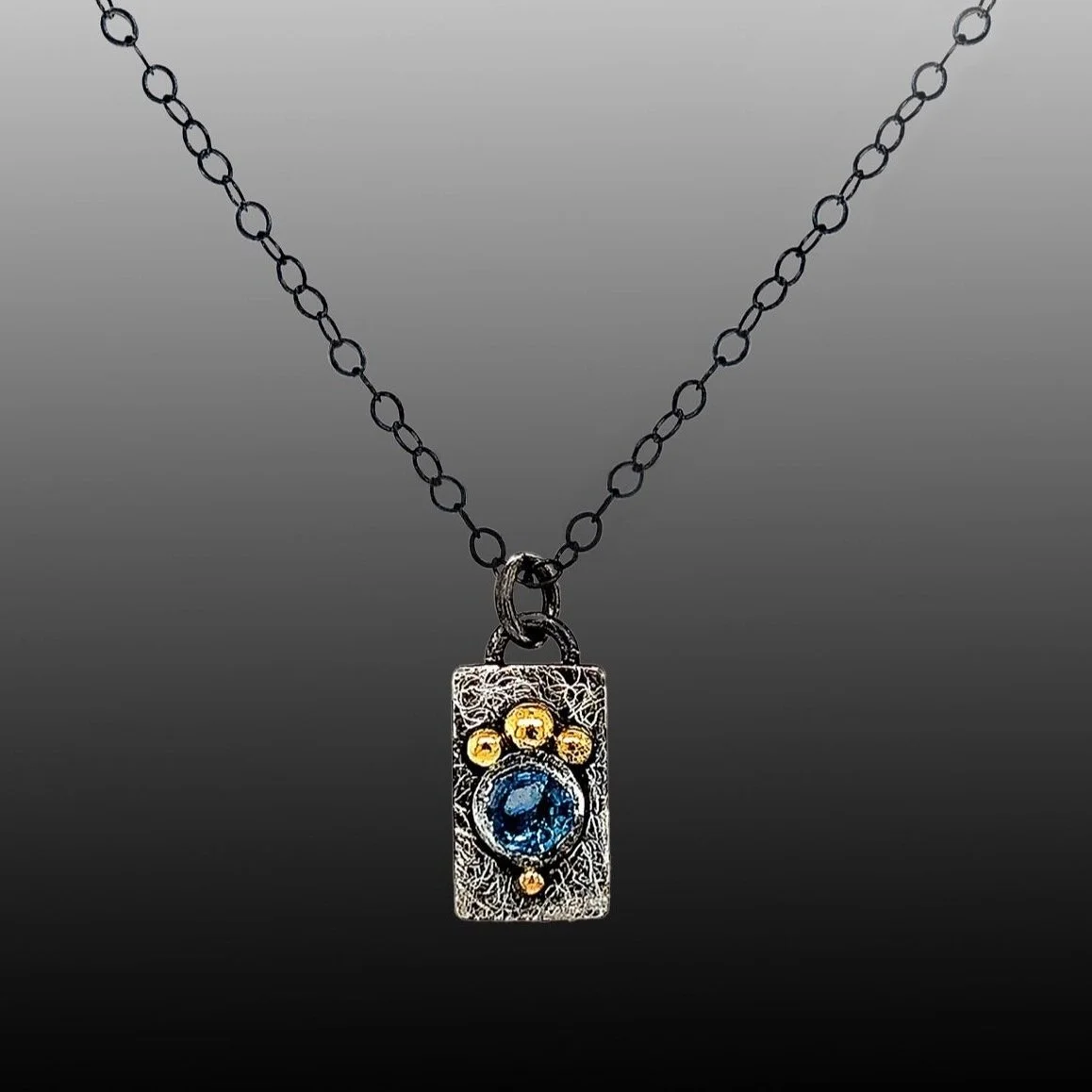 Petite glyph Charm and blue sapphire pendant of recycled gold and silver