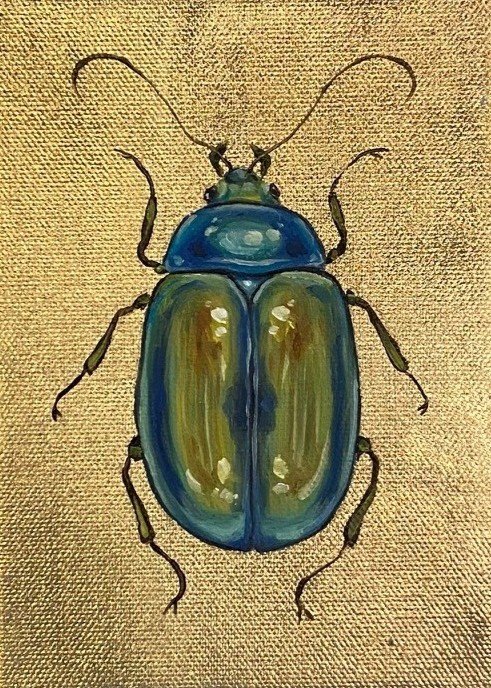 Blue and Green Beetle on Gold Background