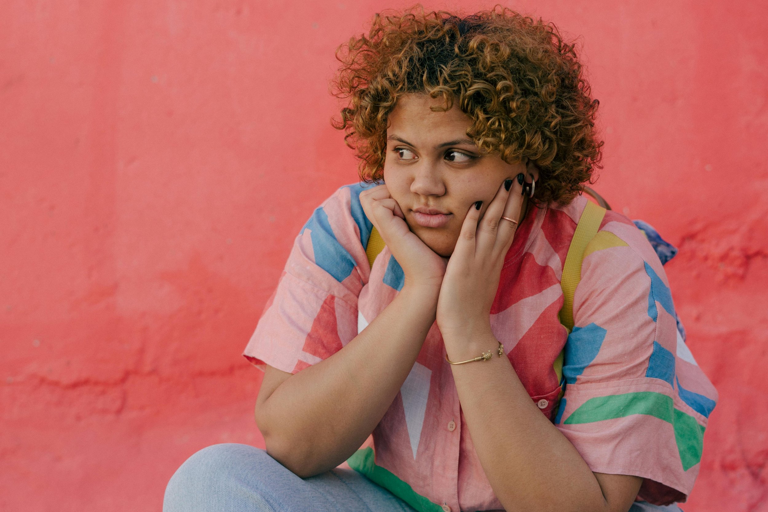 Photo of a plus size person in a colourful shirt giving side eye representing the exasperation of experiencing bias in therapy. 90015 | 90274 | 90094