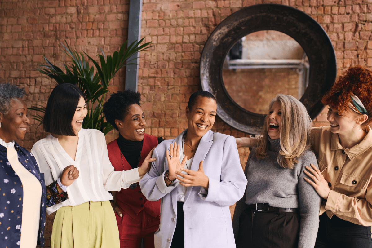 Group of friends laughing representing healthy ways to distract which can be taught through therapy for women in California 90094 | 90274 | 90266