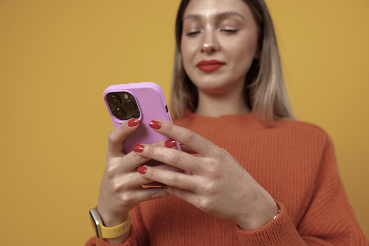 Image of a woman looking at her phone. Being on your phone could be avoidant behavior and also can be a healthy escape. 90015 | 90274 | 90402