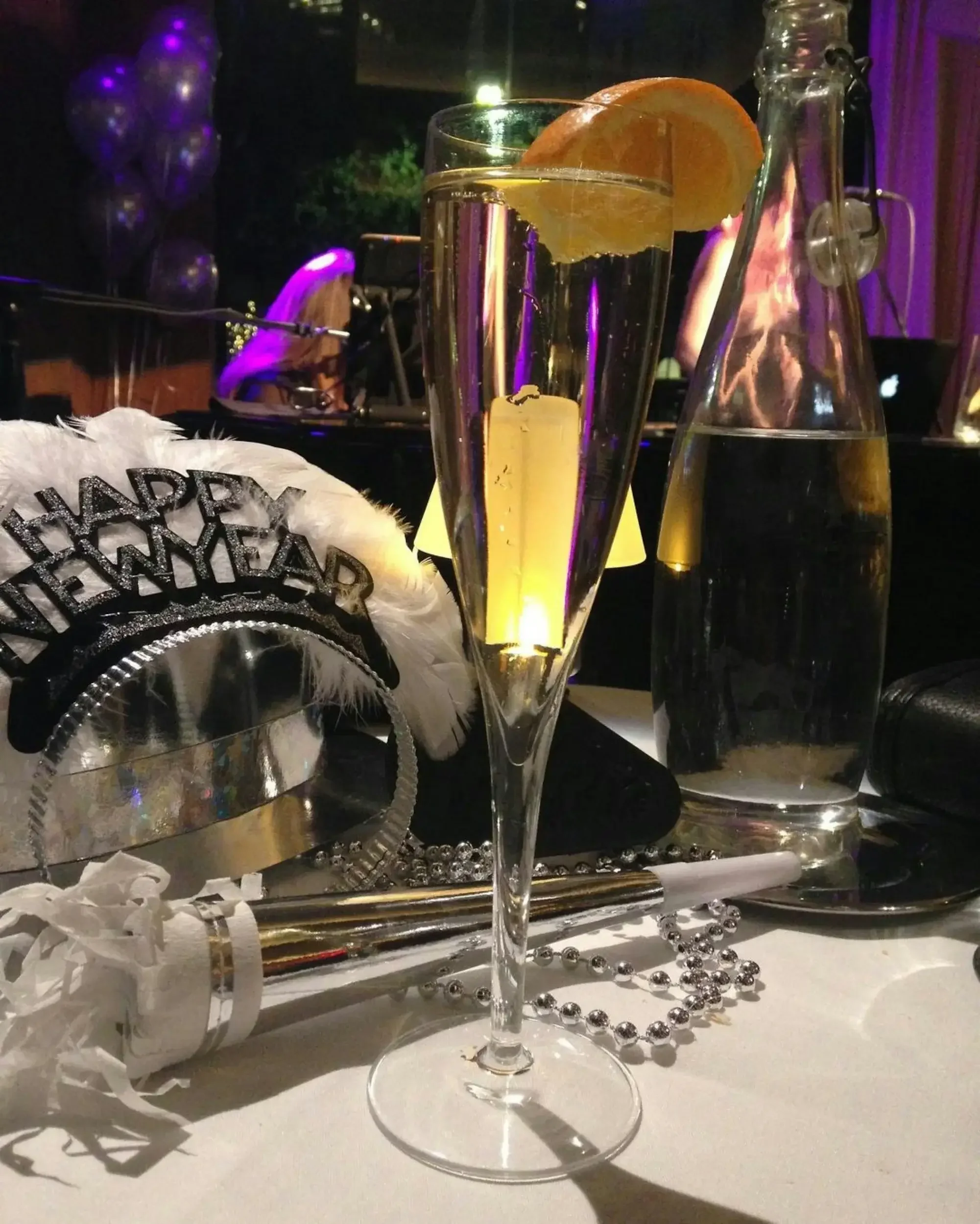 Photo of New Year's party supplies, representing change in the new year. If you'd like to feel better in your body, release shame, and take up more space in 2026, reach out to a therapist specializing in women today.  90401 | 90402 | 90274