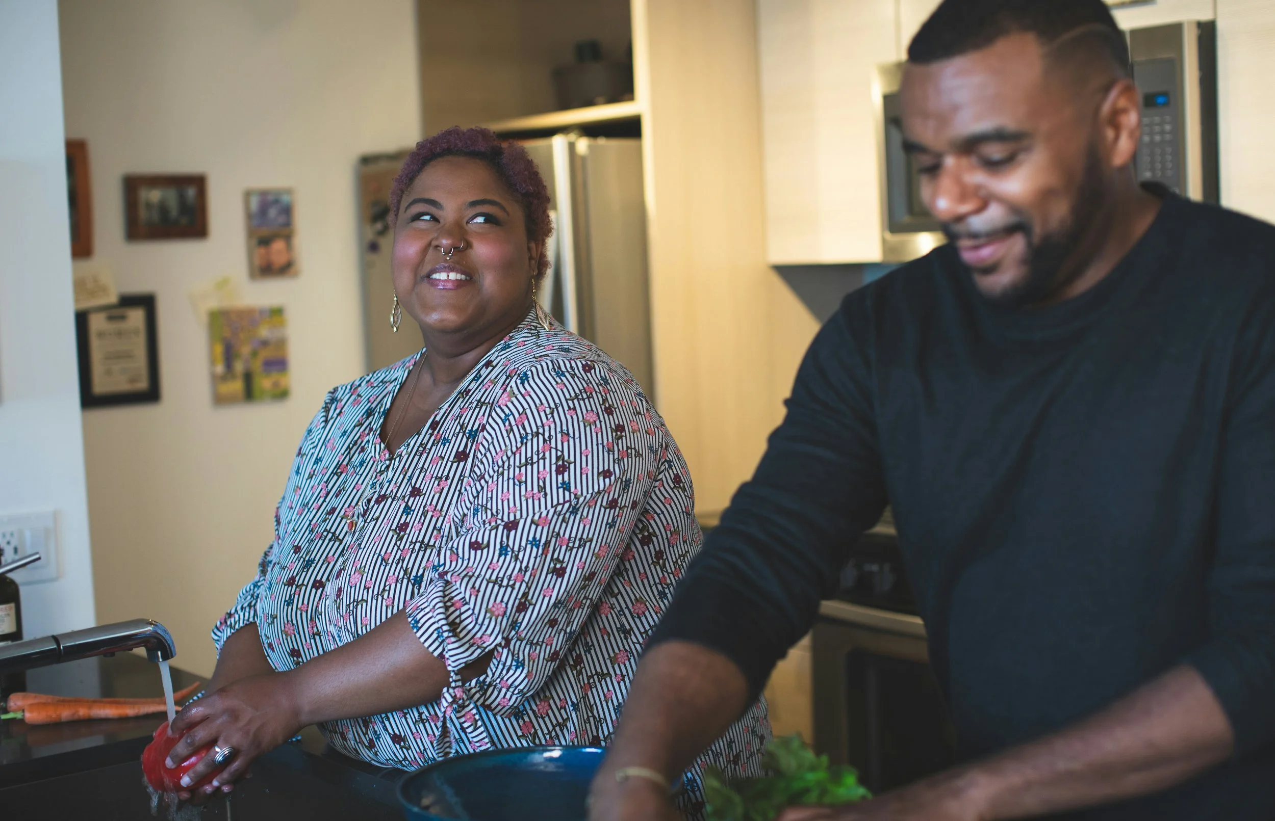 Photo of a Black couple preparing a meal in the kitchen. Therapy can help create balance in relationships from the start. 90254 | 90232 | 90069