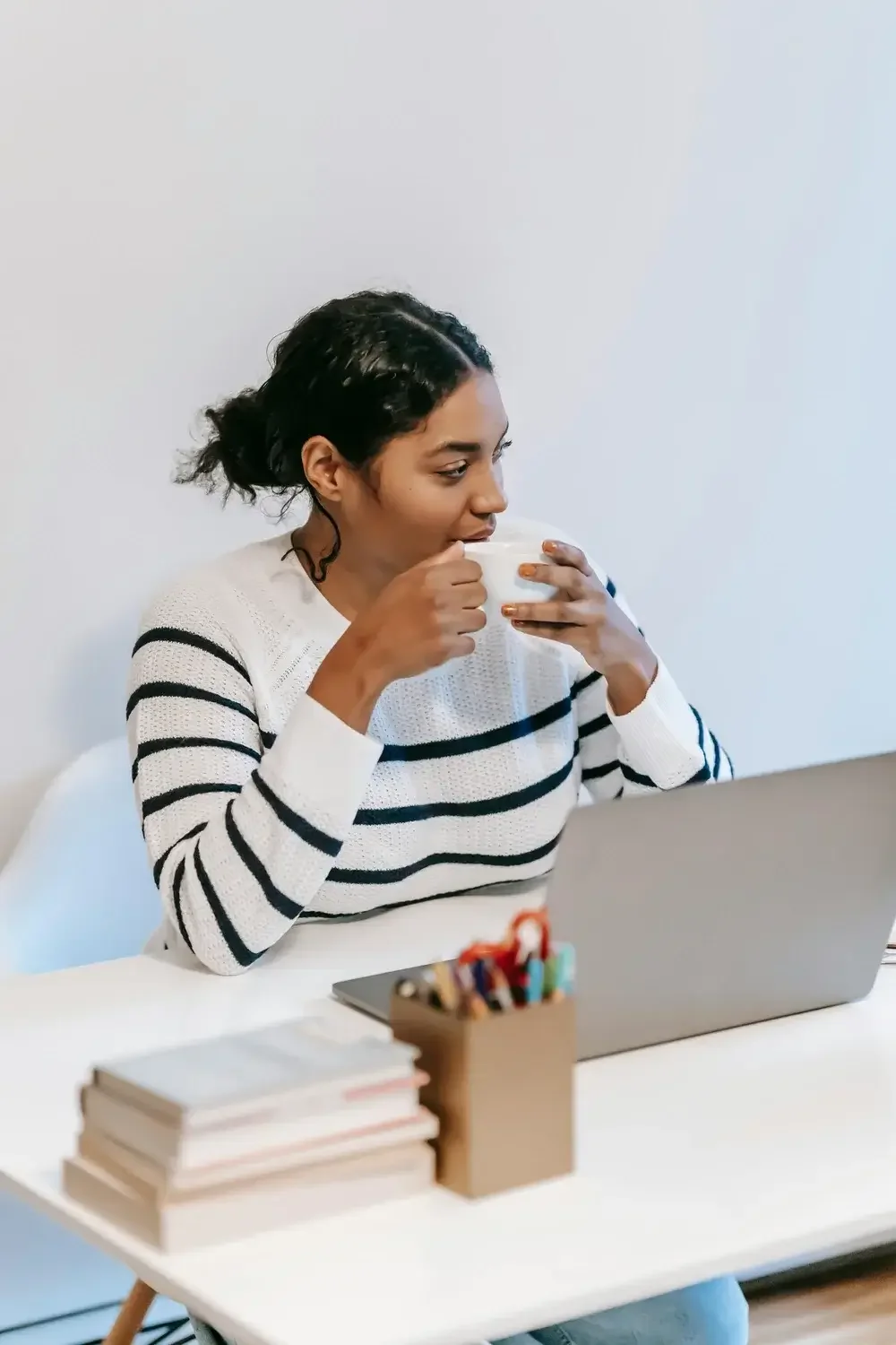 An image of a woman talking to a therapist on her laptop for a virtual session. Virtual therapy or telehealth is just as effective as in person therapy.  | 60540 |  61101 |  60432 |