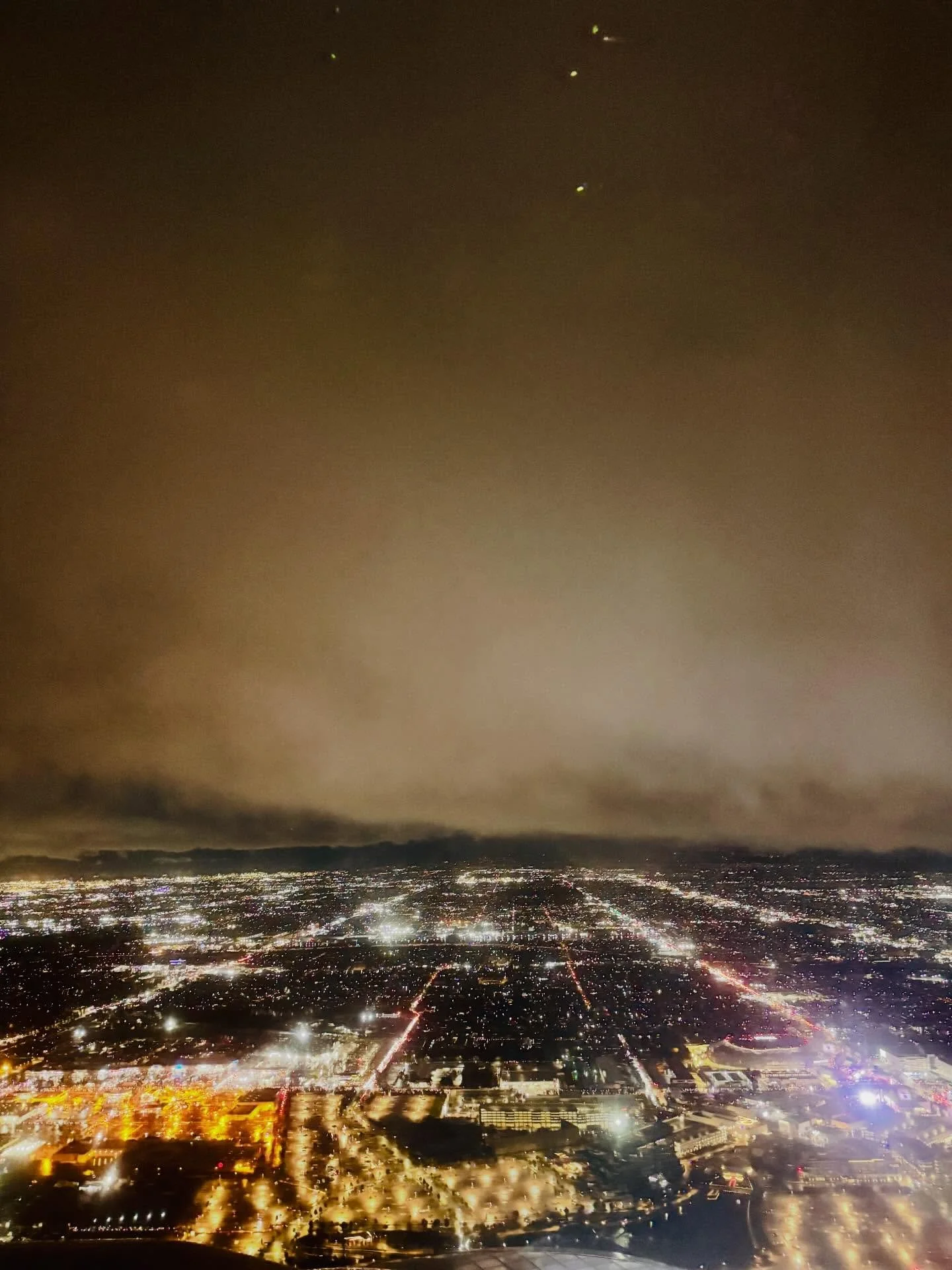 It&rsquo;s a thing, flying over LA at sunset. The horizon looked the way I imagine the Wild West looked from horseback in the 1800&rsquo;s&mdash;mysterious and glowing like hot amber. 
.
Directly below us, through a patchwork of broken clouds, lights