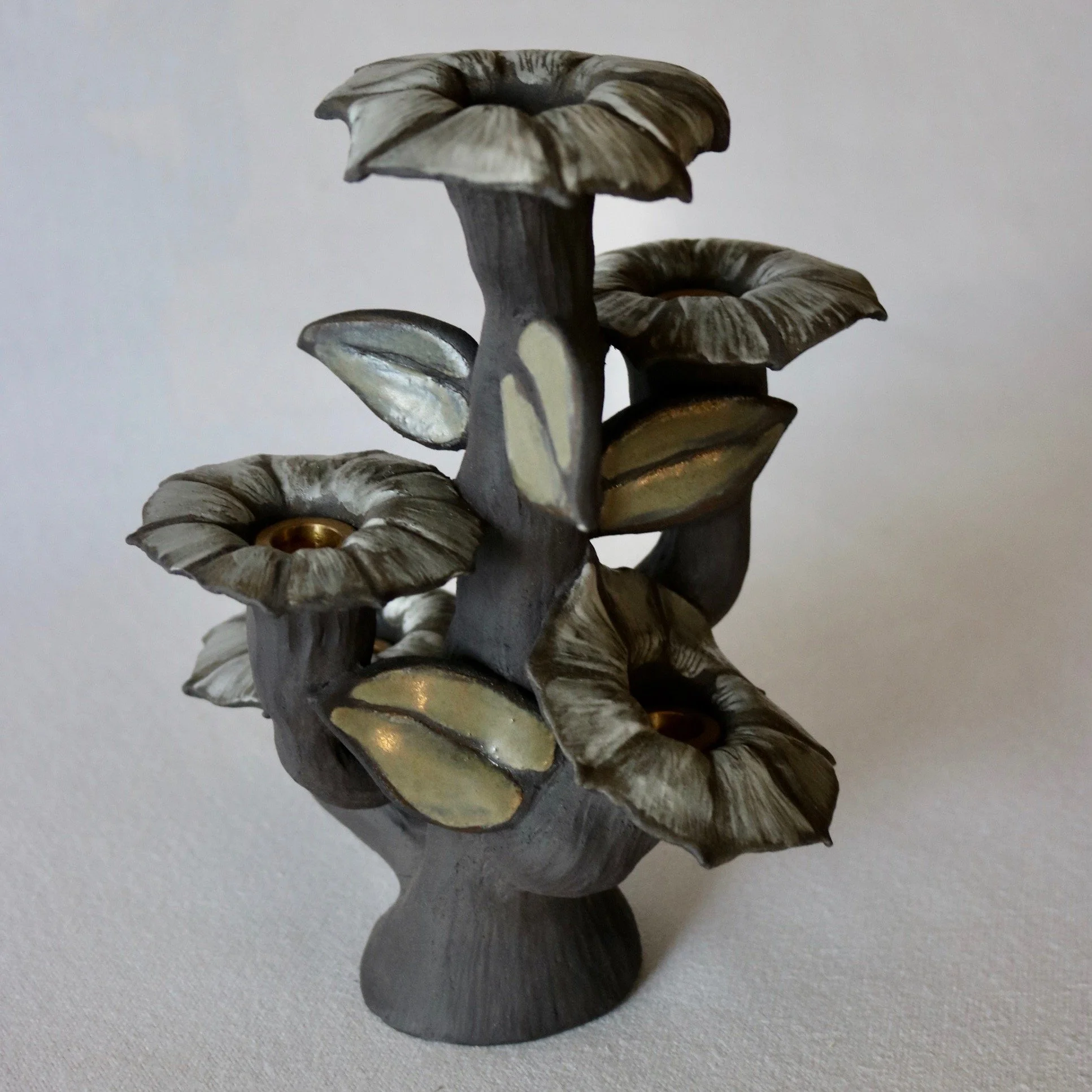 Handsculpted black stoneware moonflower candleabra made in New Zealand.