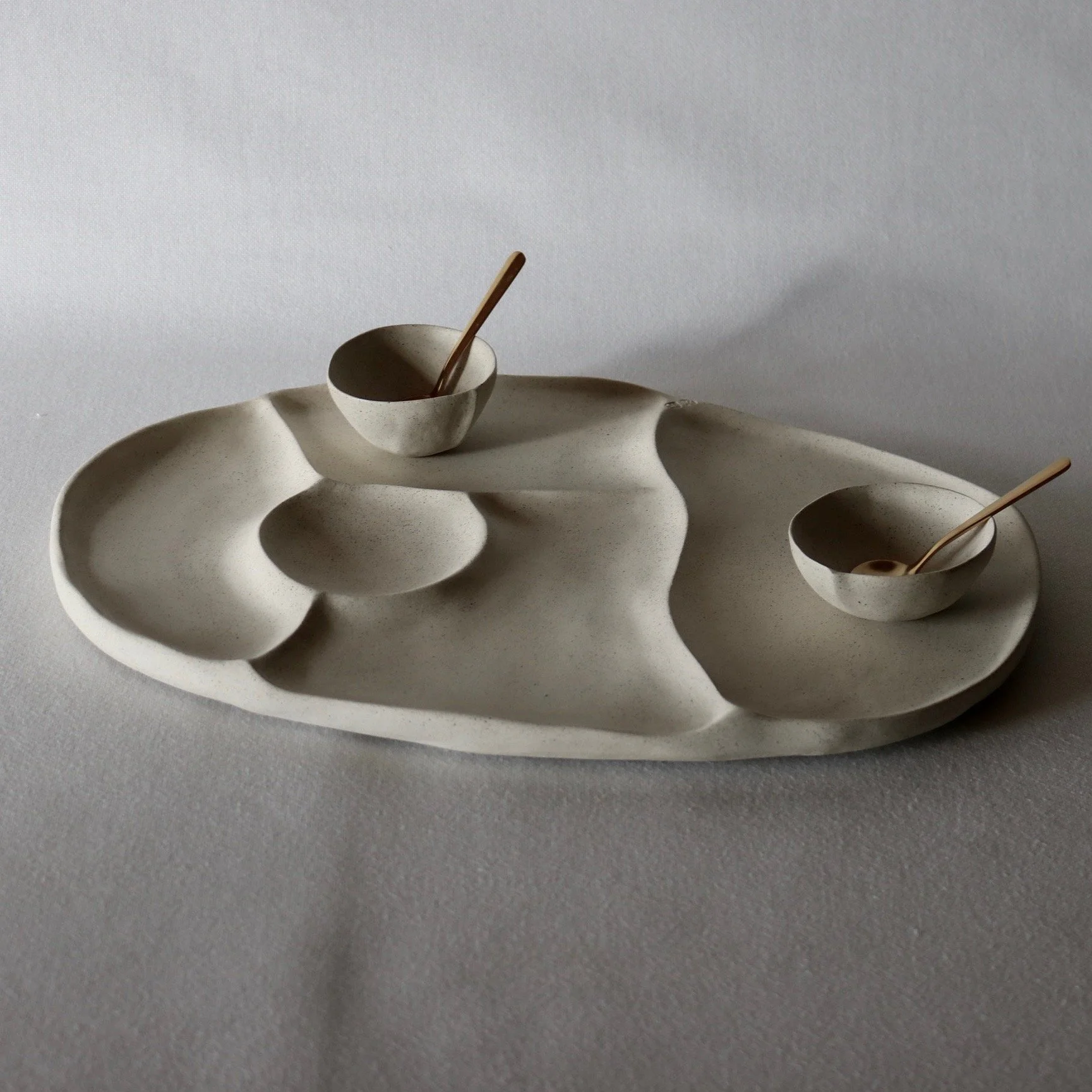 Oval River Rock platter with spoons.jpeg