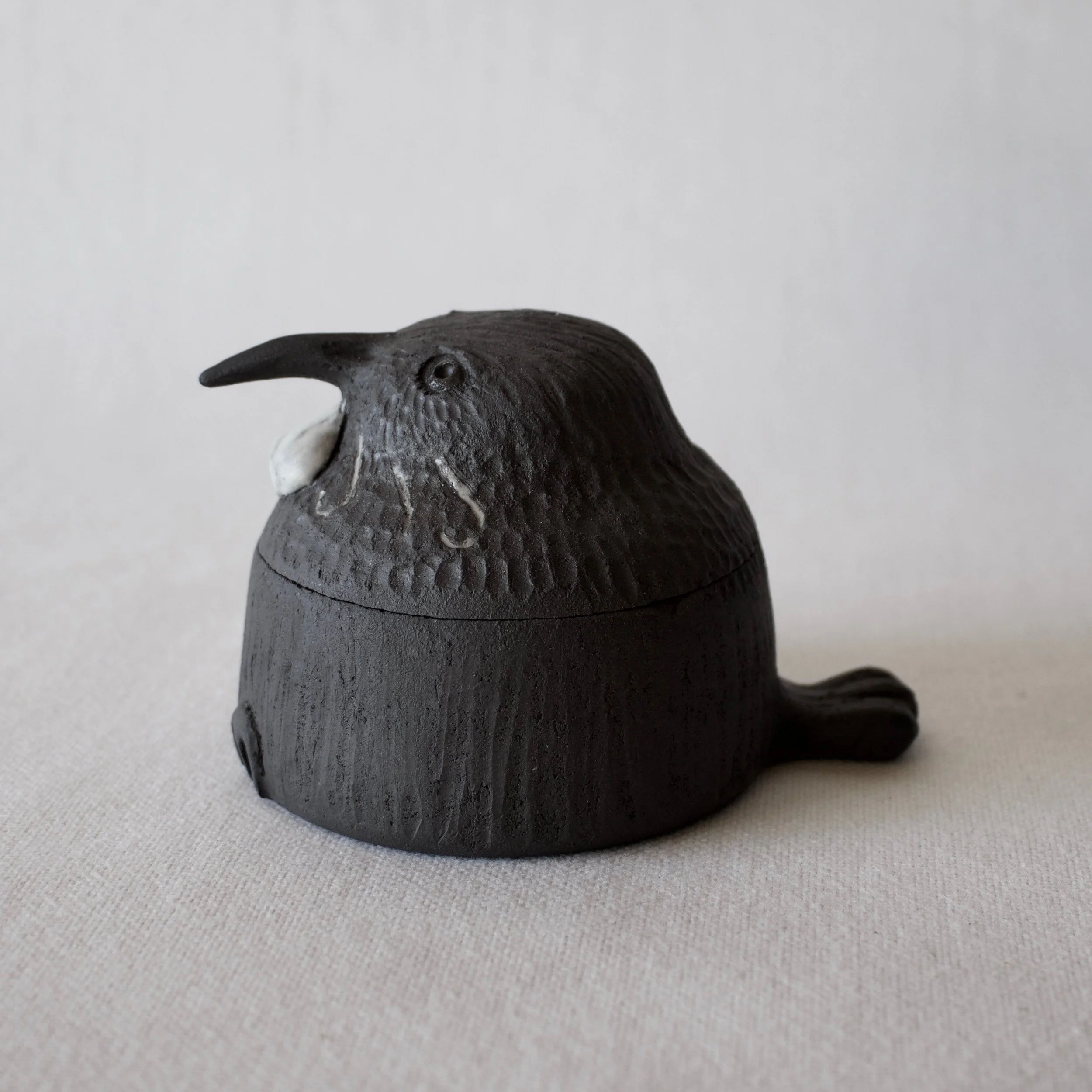 Mini ceramic Tui Trinket Box side view.jpeg