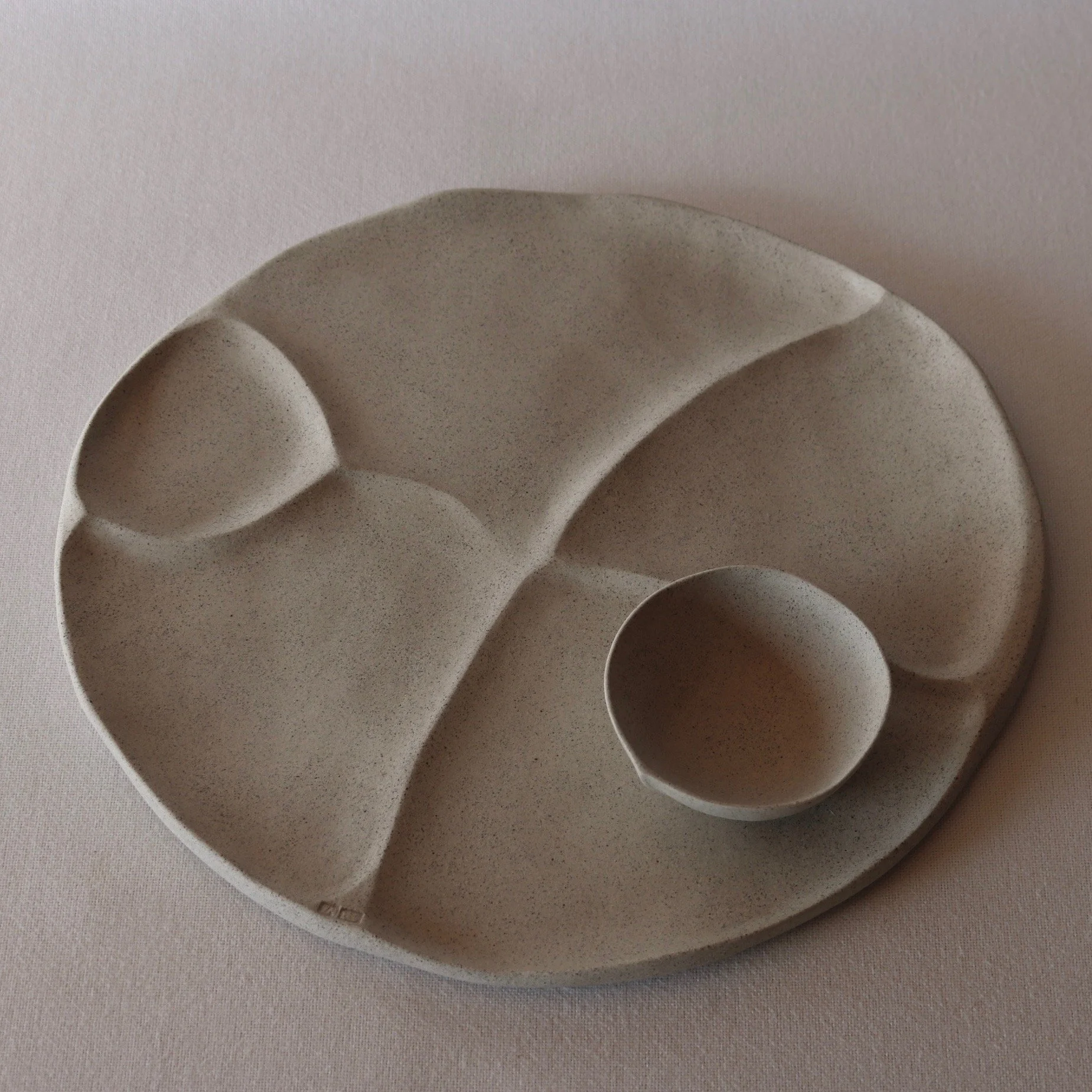 ceramic pebble platter round.jpeg
