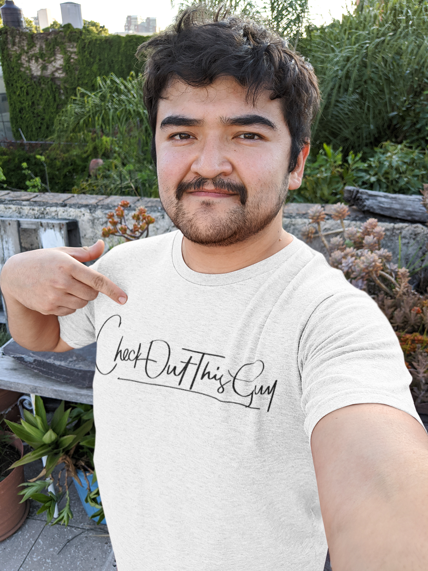 selfie-mockup-of-a-man-pointing-at-his-heathered-t-shirt-36764.png