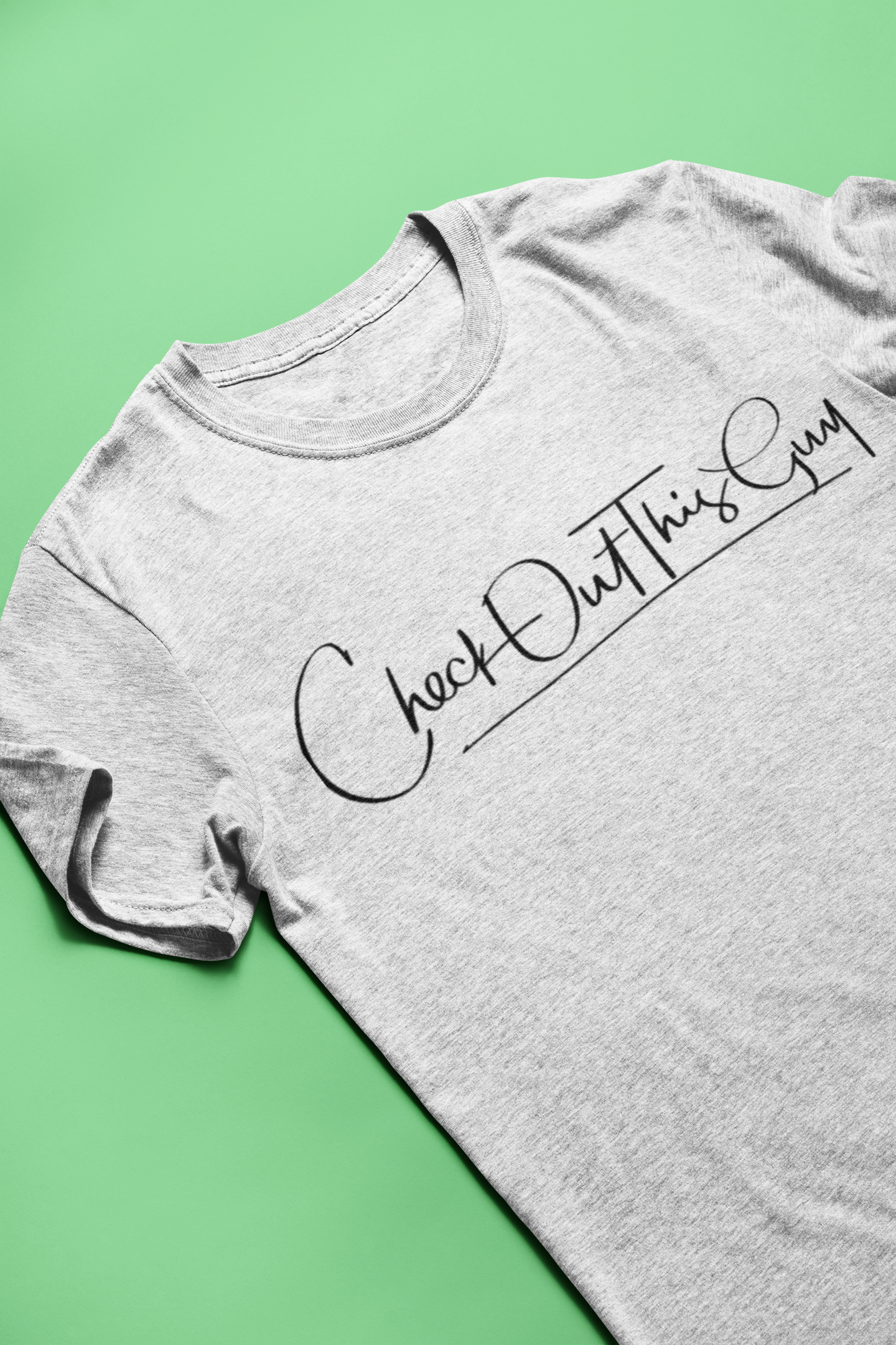mockup-of-a-heather-t-shirt-lying-on-a-solid-surface-24207.png