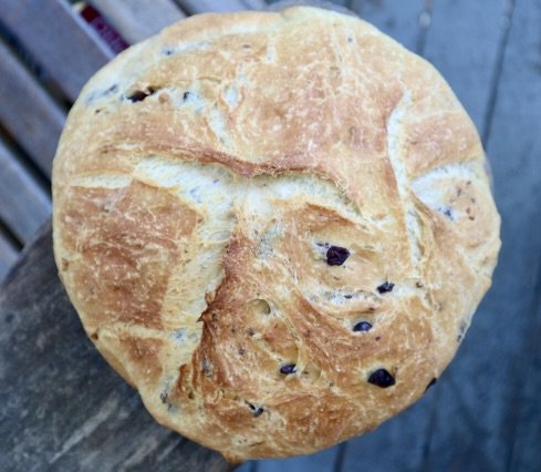 circular olive bread with golden-brown crust