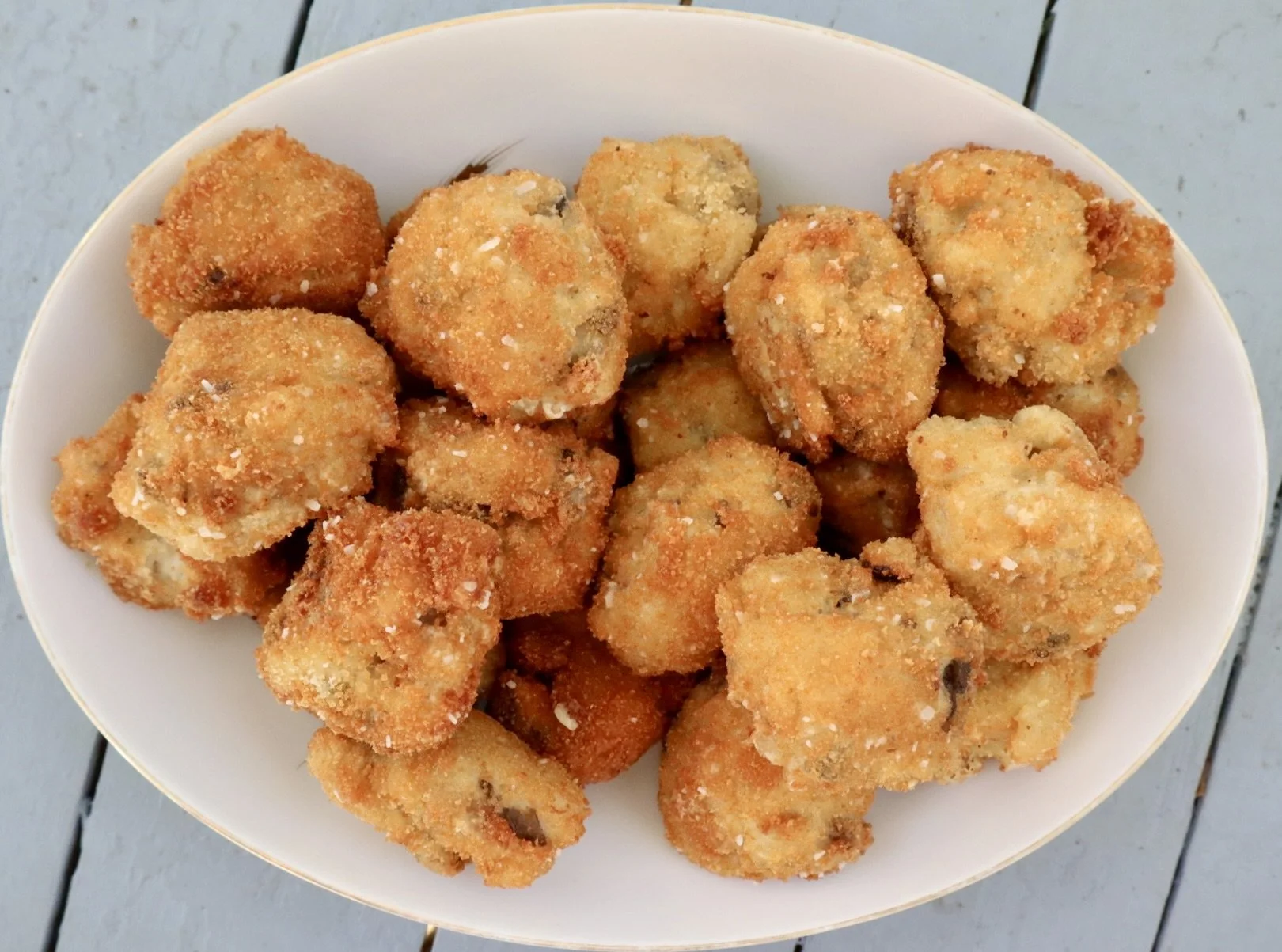Mushroom croquettes in a white serving bowl