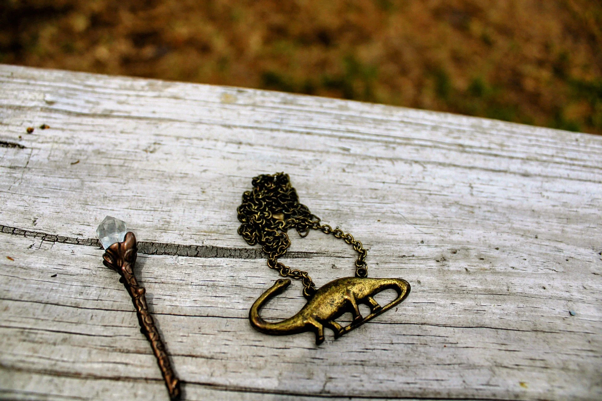 pewter bronze brontosaurus necklace and wand with clear quartz crystal