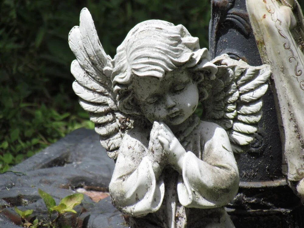 An angelic statue in the graveyard