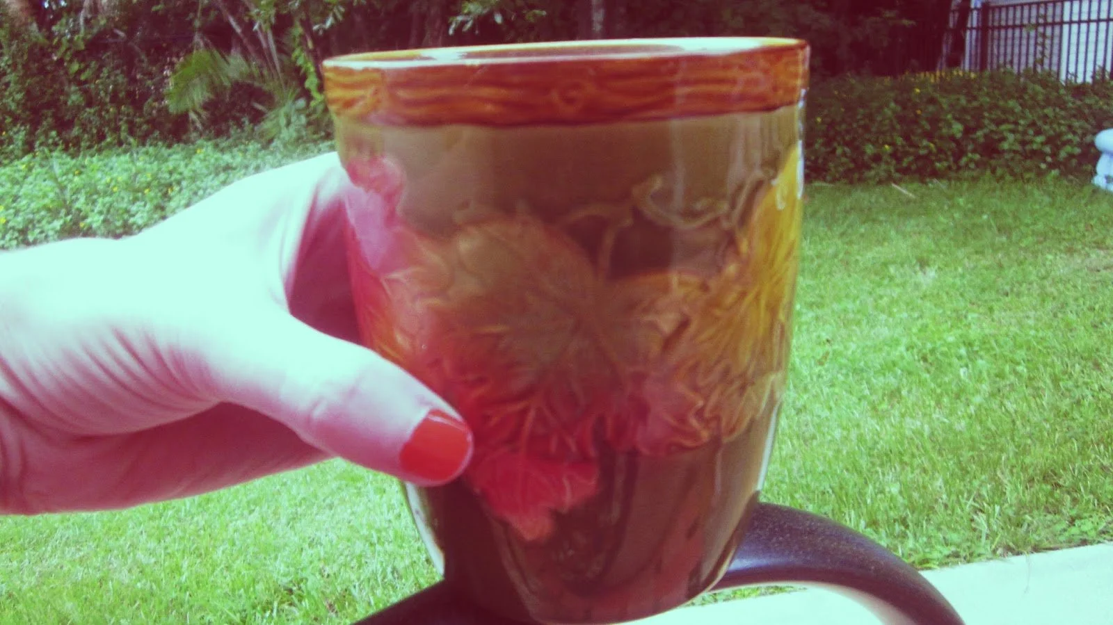 Painted finger nails and a cute autumn tea mug