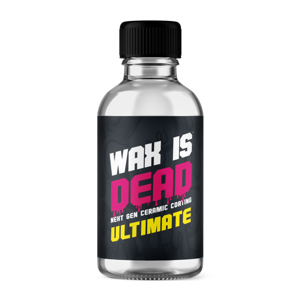 A small clear bottle labeled "Wax Is Dead Ultimate" with a black cap and colorful text, designed for a product related to ceramic coating.