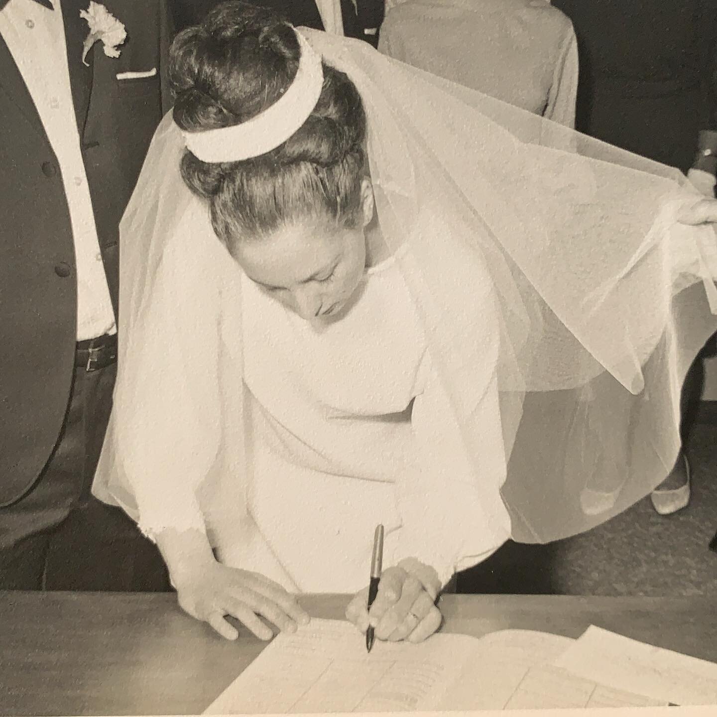 My Mumzie signing the register in 1969. Dad is standing next to her and the minister is holding her veil. Lol.  Nowadays we still sign &ldquo;the register&rdquo;, in fact you, your partner and your celebrant each sign three certificates. I love seein