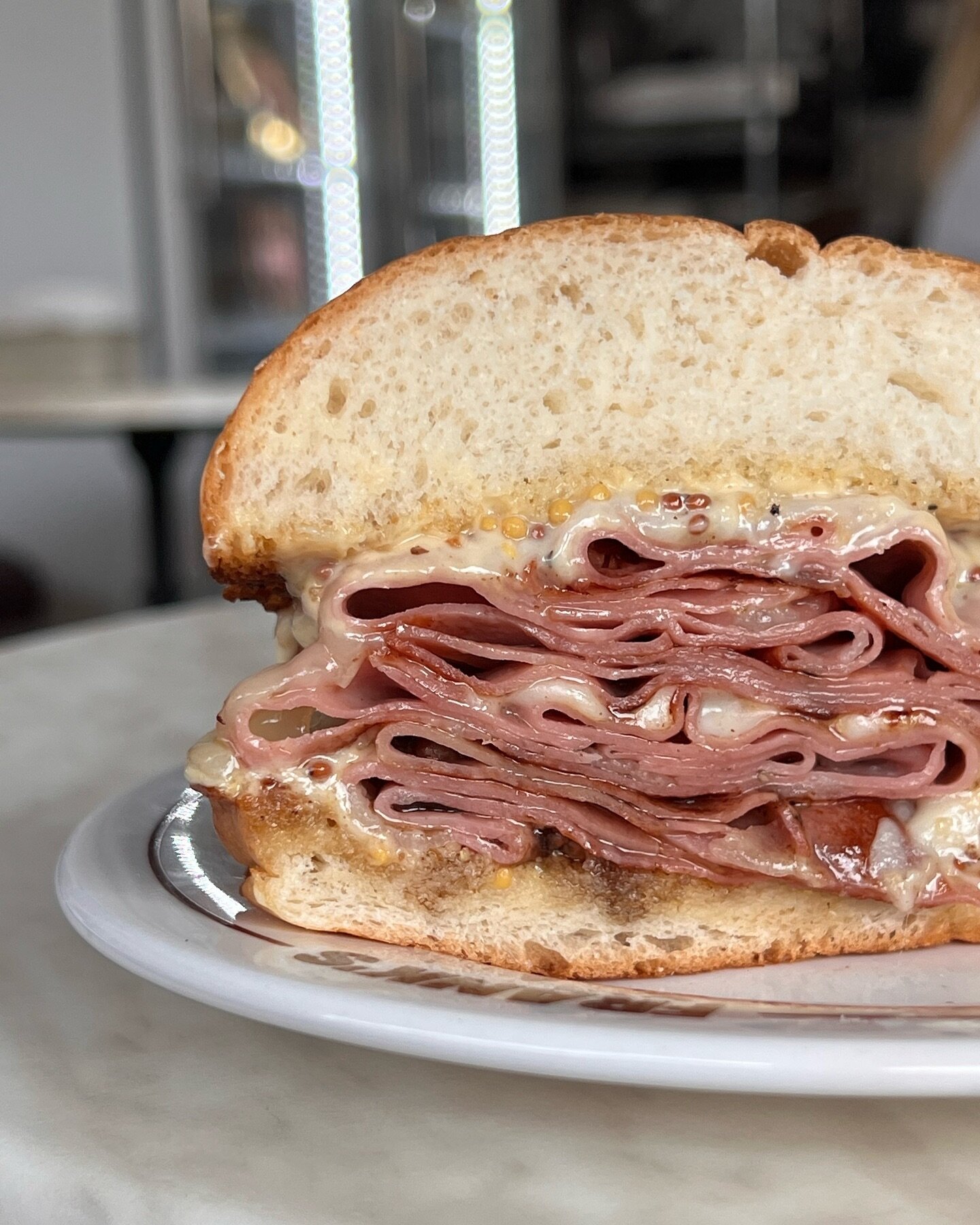 Cross section of the our Fried Mortadella Melt. 🤤 A classic created by food god Anthony Bourdain! Available all weekend @ Frank&rsquo;s! 🙌🏻🍔