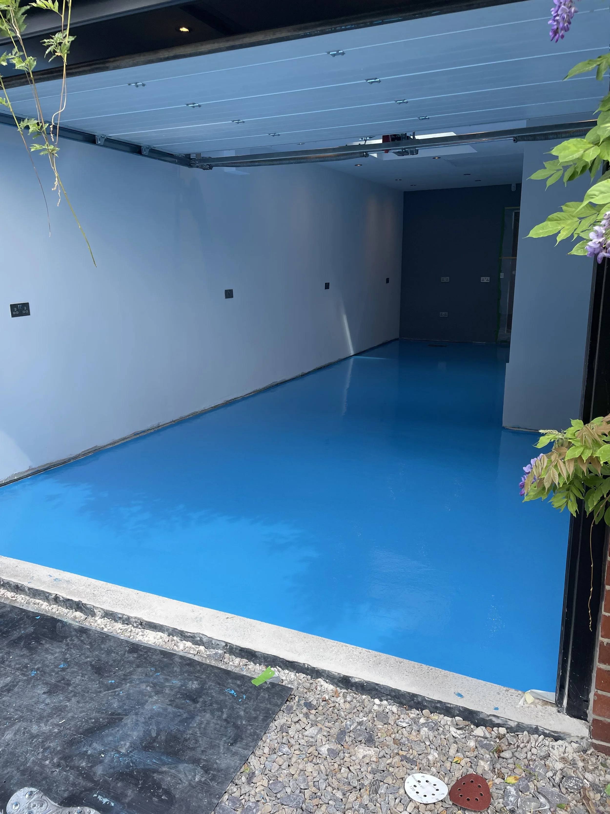 Waterproof epoxy coating applied to a Sheffield garage floor for enhanced protection and durability.