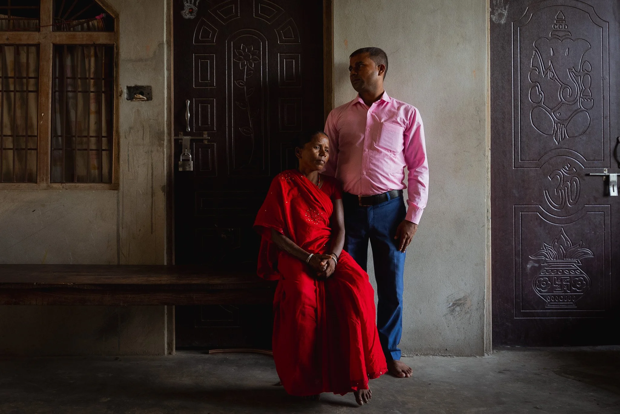 An unnamed survivor of obsteric fistula poses for a portrait with her brother who supports her, Janakpur, Nepal.