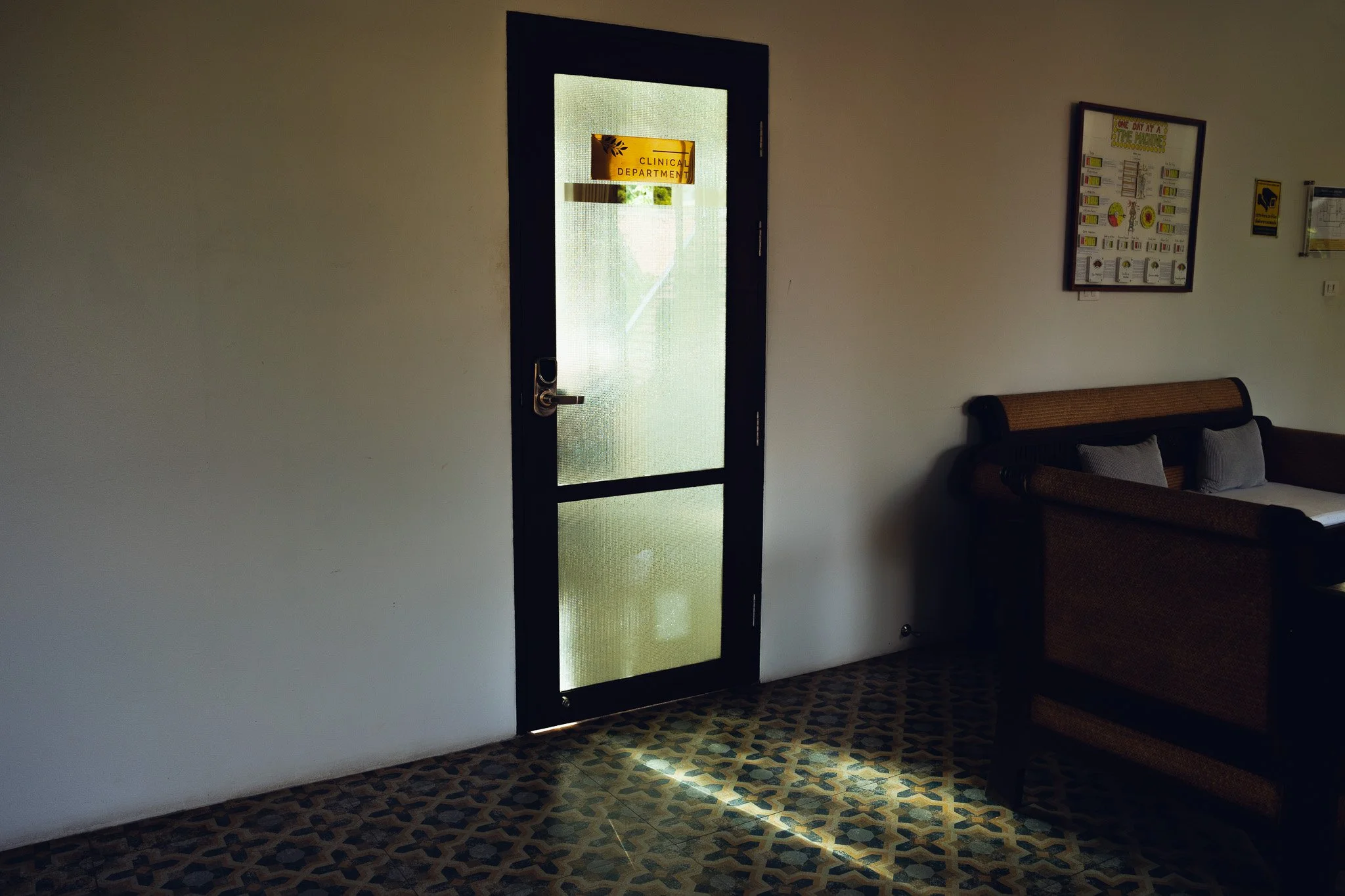Light pours through the glass door of the Clinical Department office at the Dawn Clinic.