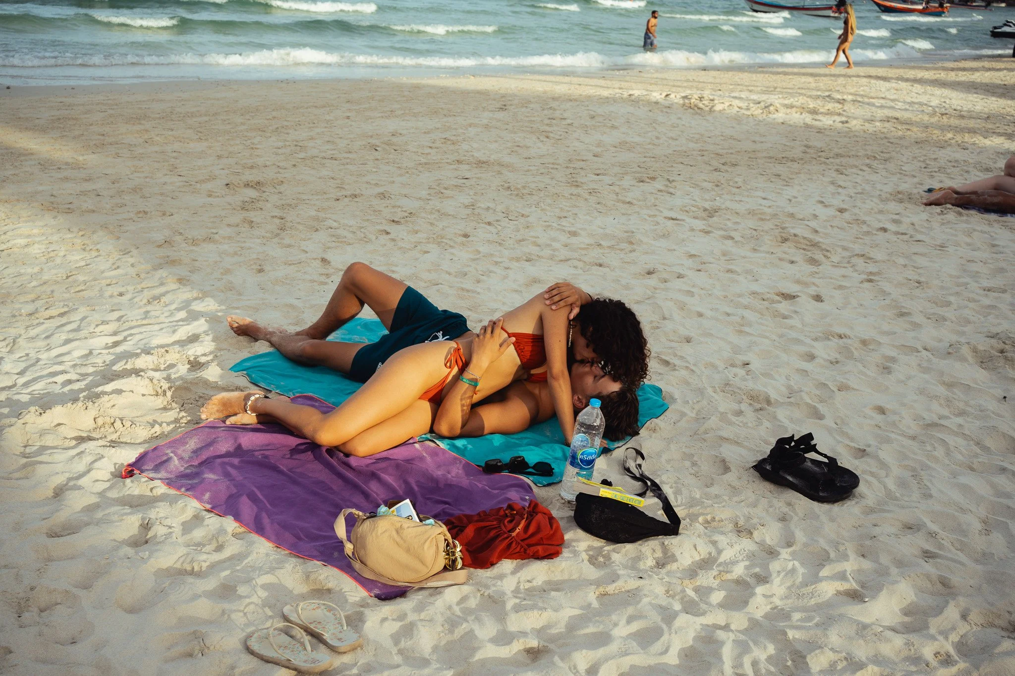 A couple enjoys a romantic moment on Haan Rin beach, the site of the Full Moon Party.