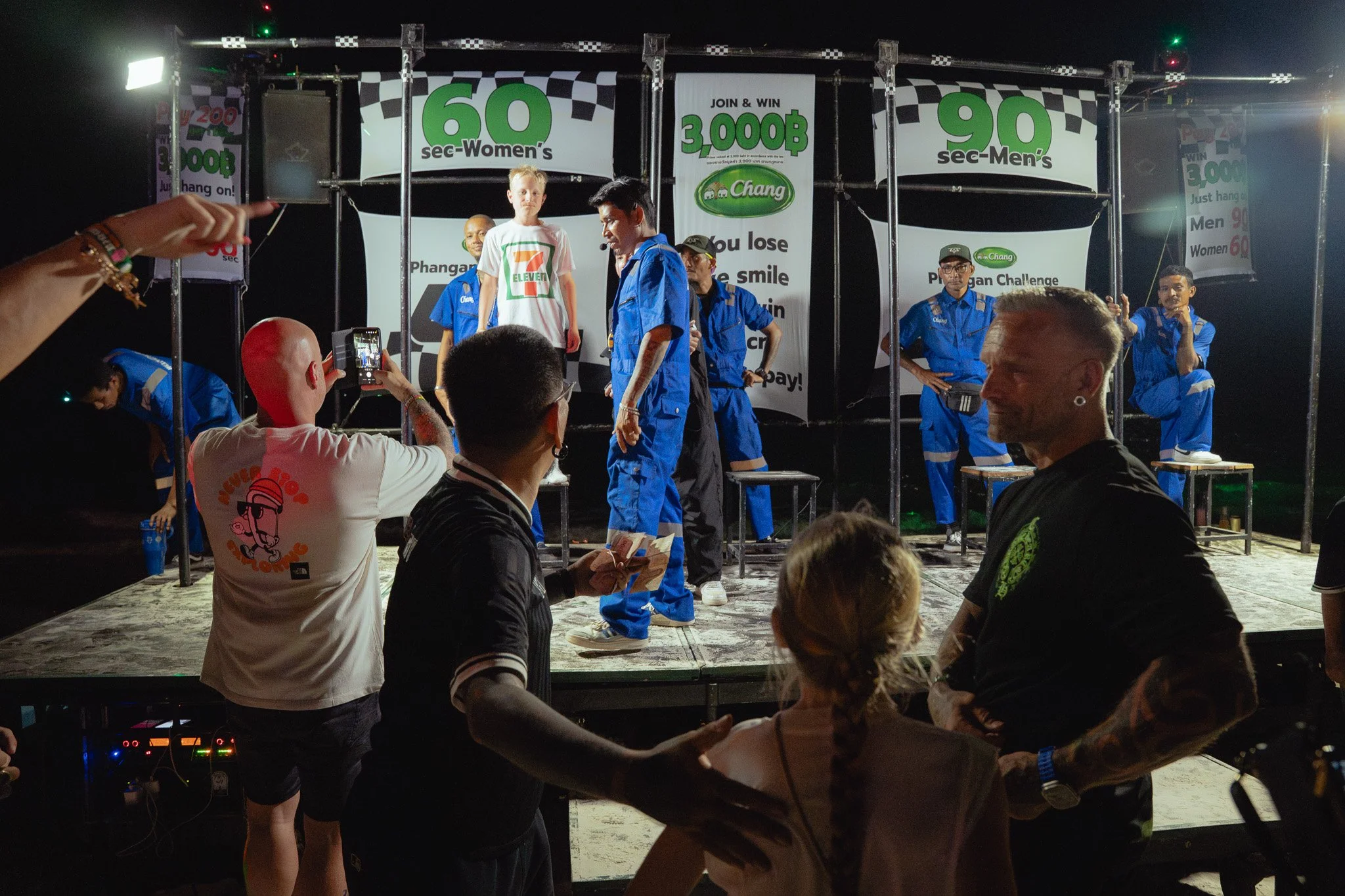 Two children decide to take on the "Hang-Man" Challenge, ushered onto stage by the host of the game.
