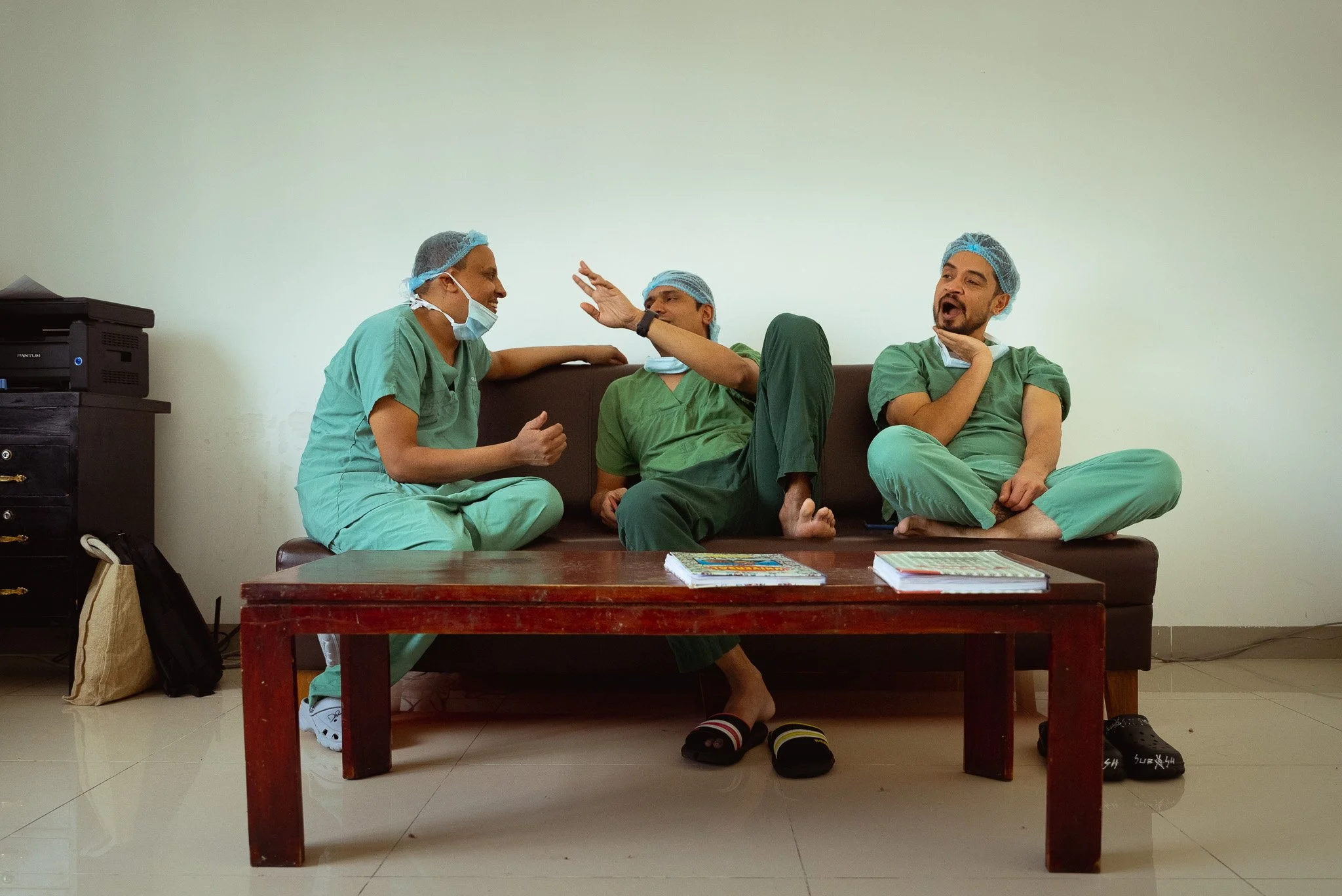 Surgeons in the staff room relax between surgeries at the B.P. Koirala Institute of Health Sciences, Obstetrics and Gynaecology department, Dharan.