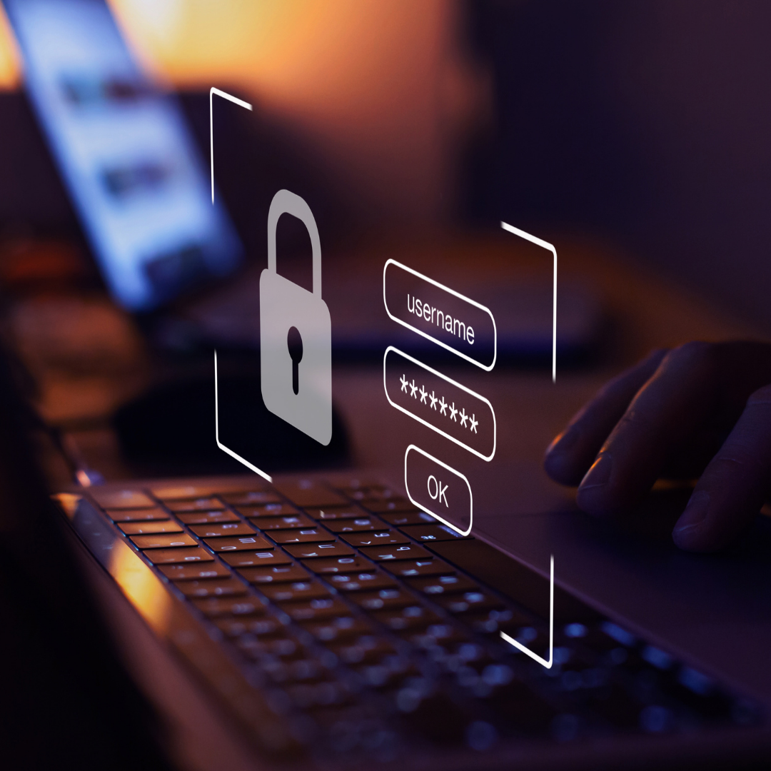 graphic overlay of a login portal hovers above a hand on keyboard, logging in