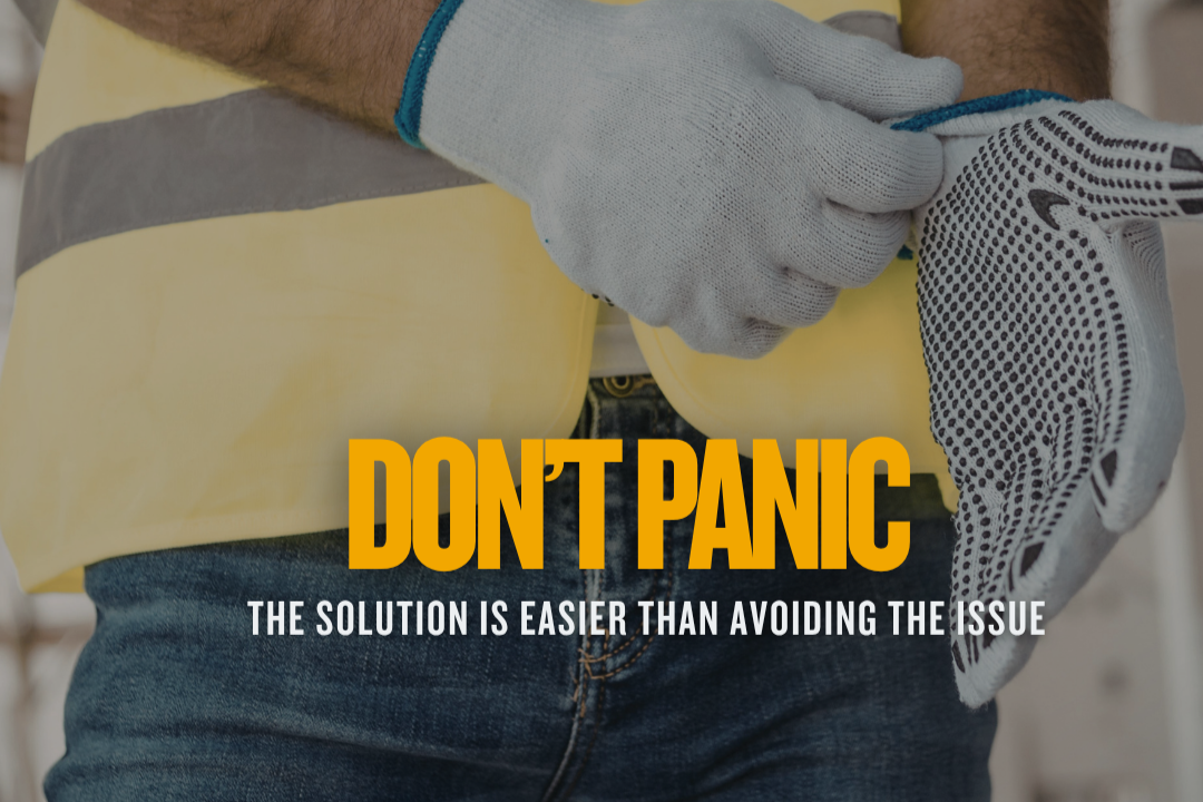 a worked puts on gloves overlaid with caption "Don't Panic. The Solution Is easier than Avoiding the Issue"