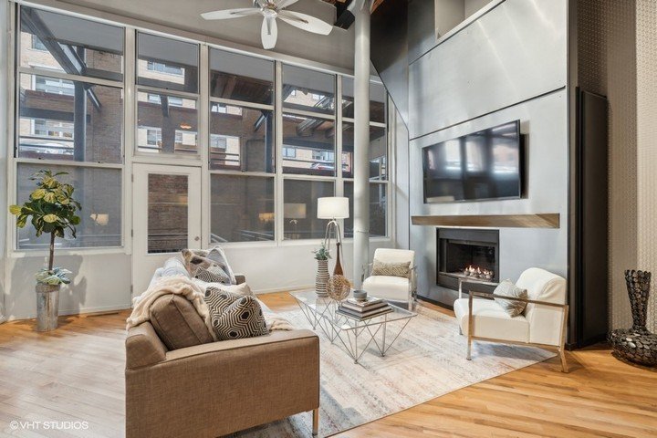 Every property is unique and this triplex timber loft in the heart of the West Loop was no different.

Crisp neutral colors and warm blue tones complemented the metallic finishes and industrial vibes to create a warm welcome for prospective buyers. 
