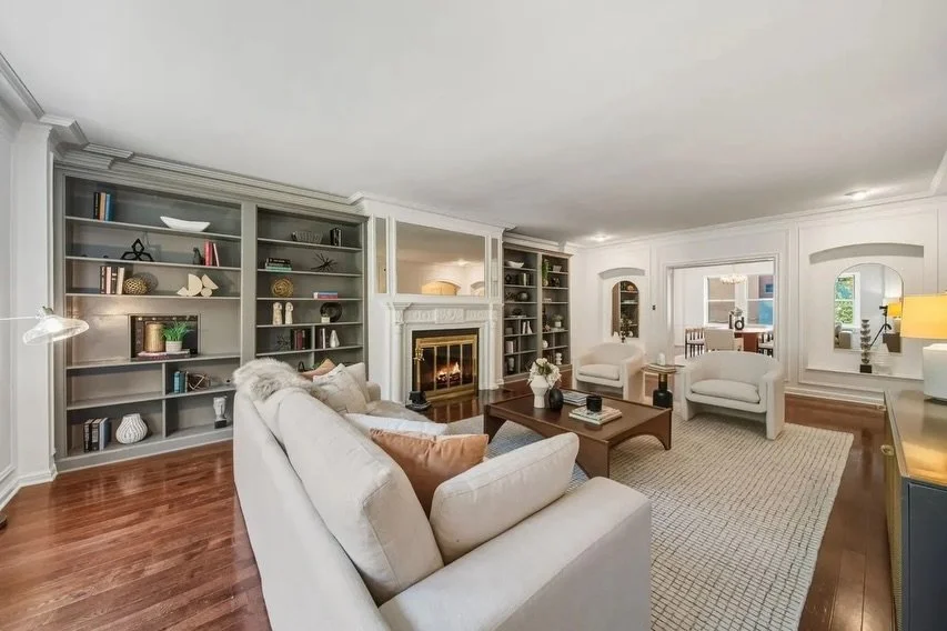 The goal staging this home was to create a layered, elevated warmth that highlights both its scale and architectural charm.

We leaned into soft neutrals, sculptural seating, and a mix of textures to bring balance to the expansive built-ins and the c