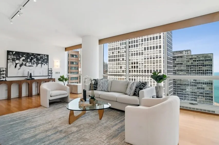 For this rarely available corner unit at The Pearson, we layered modern pieces with a more moody palette (think: dark grays, blacks, and pops of blue and green) while keeping the focus on the home&rsquo;s expansive floor-to-ceiling windows and breath
